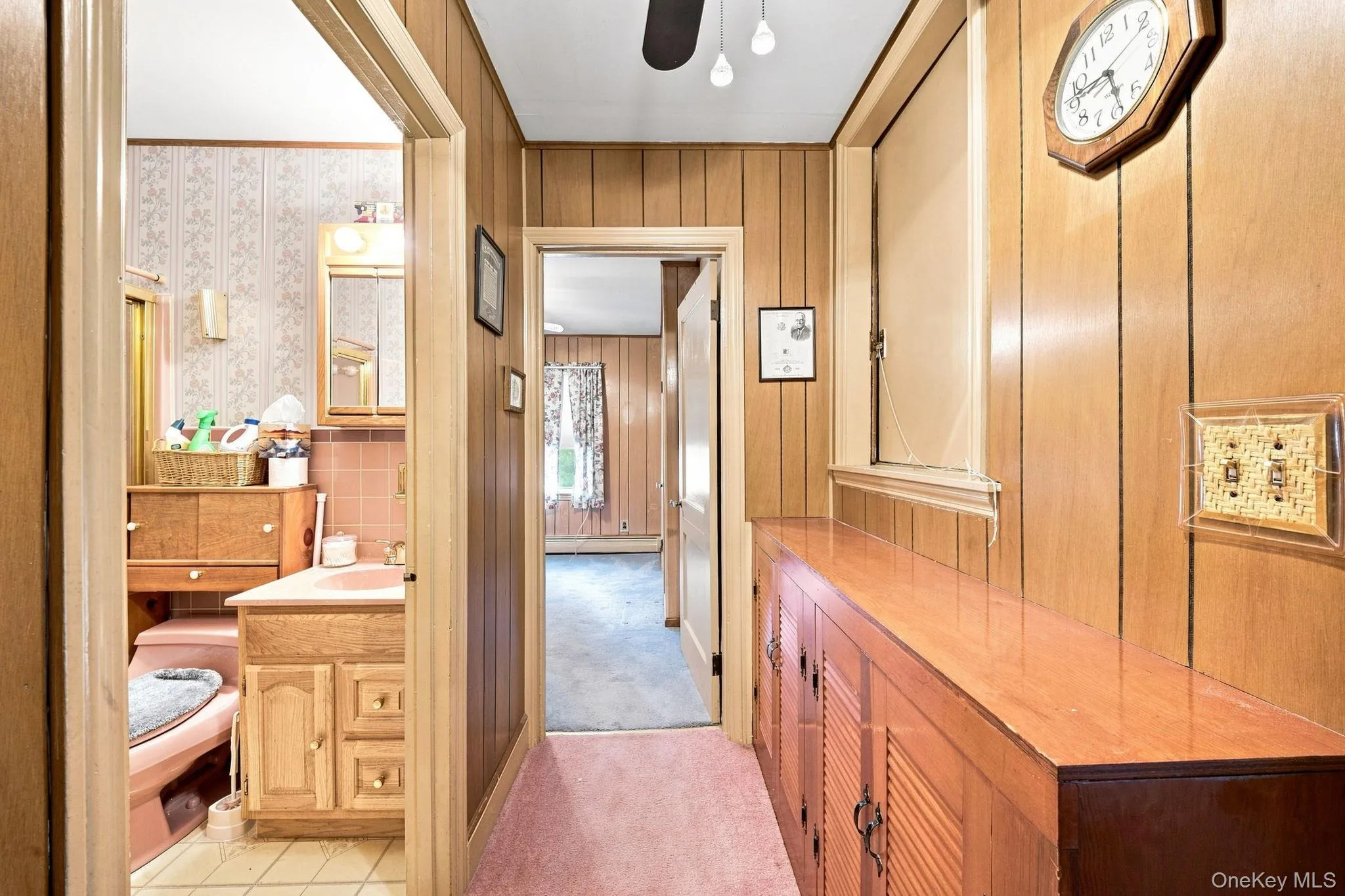 paneled walls, wall to wall carpet, opening to attic paneled walls, wall to wall carpet, opening to attic