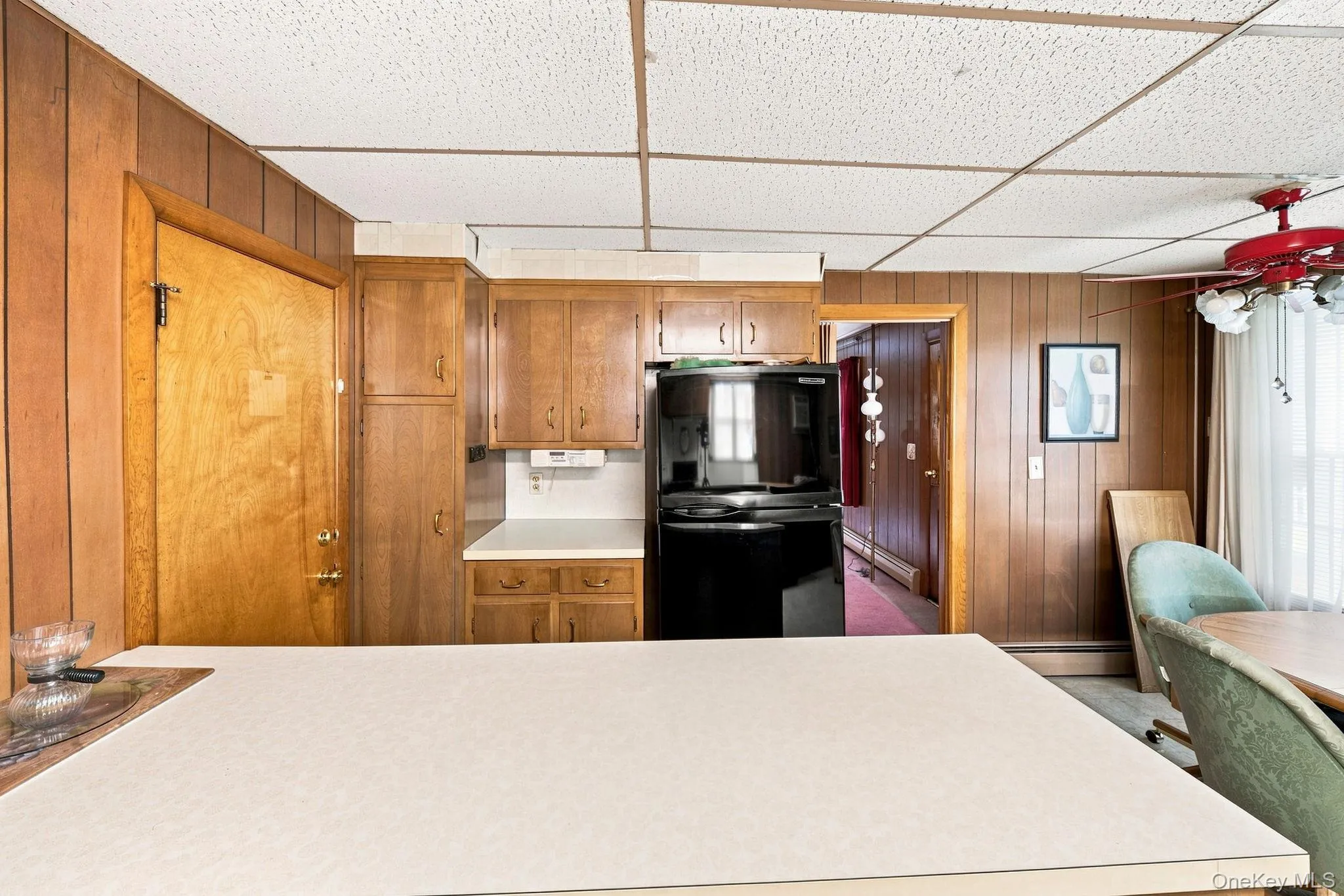 Spacious kitchen with long island, eating area with fan/light Spacious kitchen with long island, eating area with fan/light