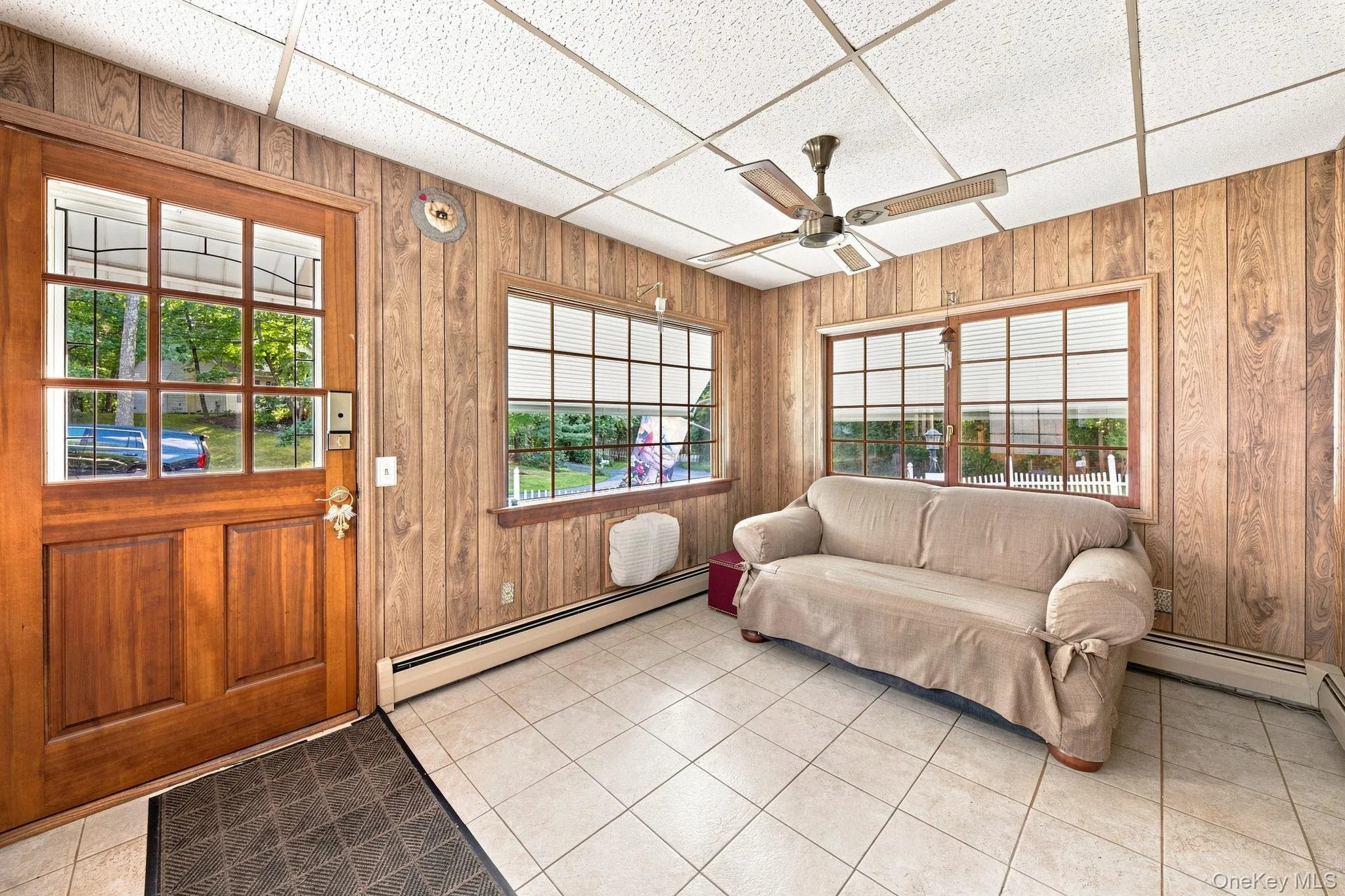 paneled walls and large windows all around, fan paneled walls and large windows all around, fan