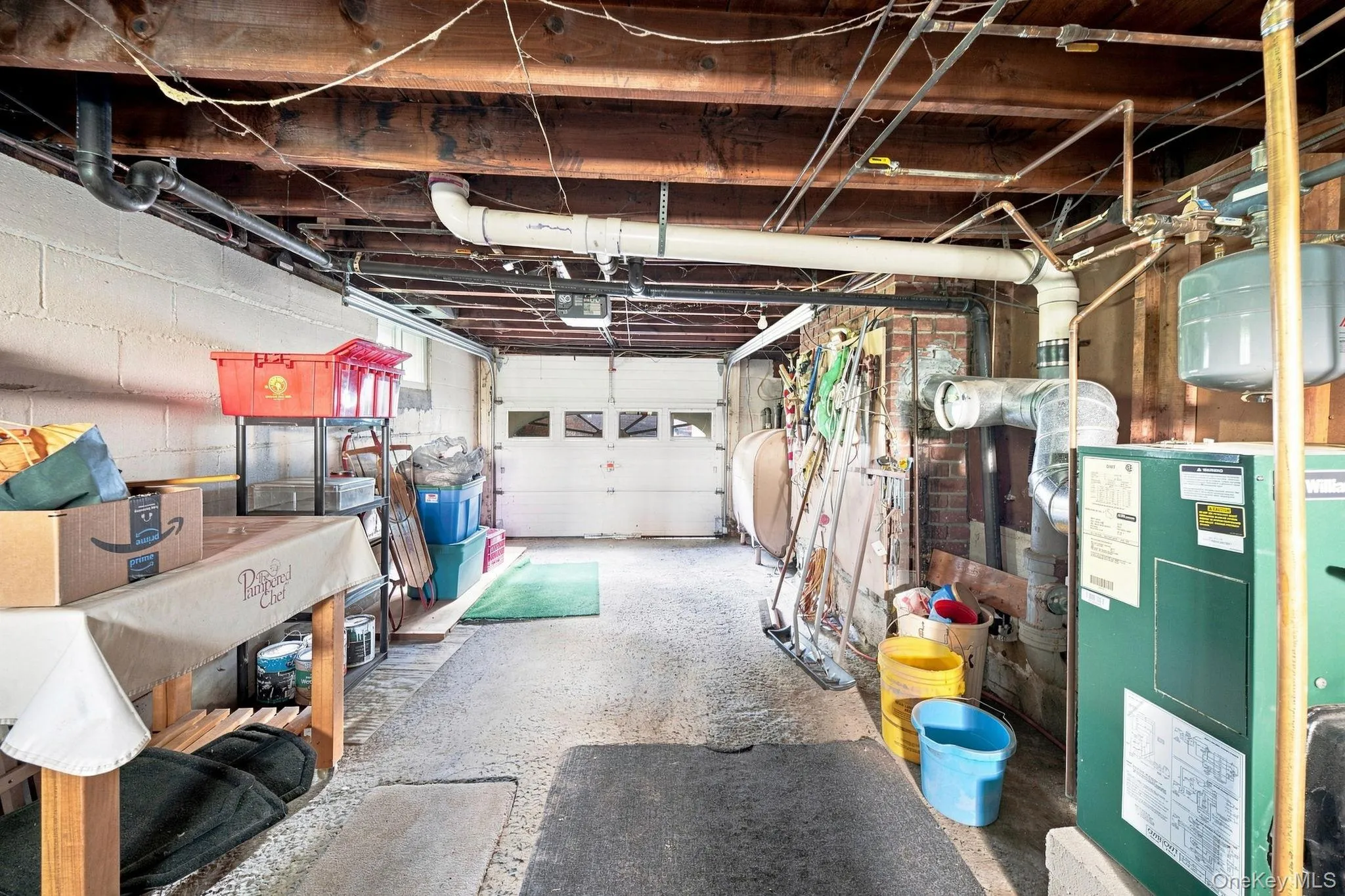 garage with utilities and washer and dryer garage with utilities and washer and dryer