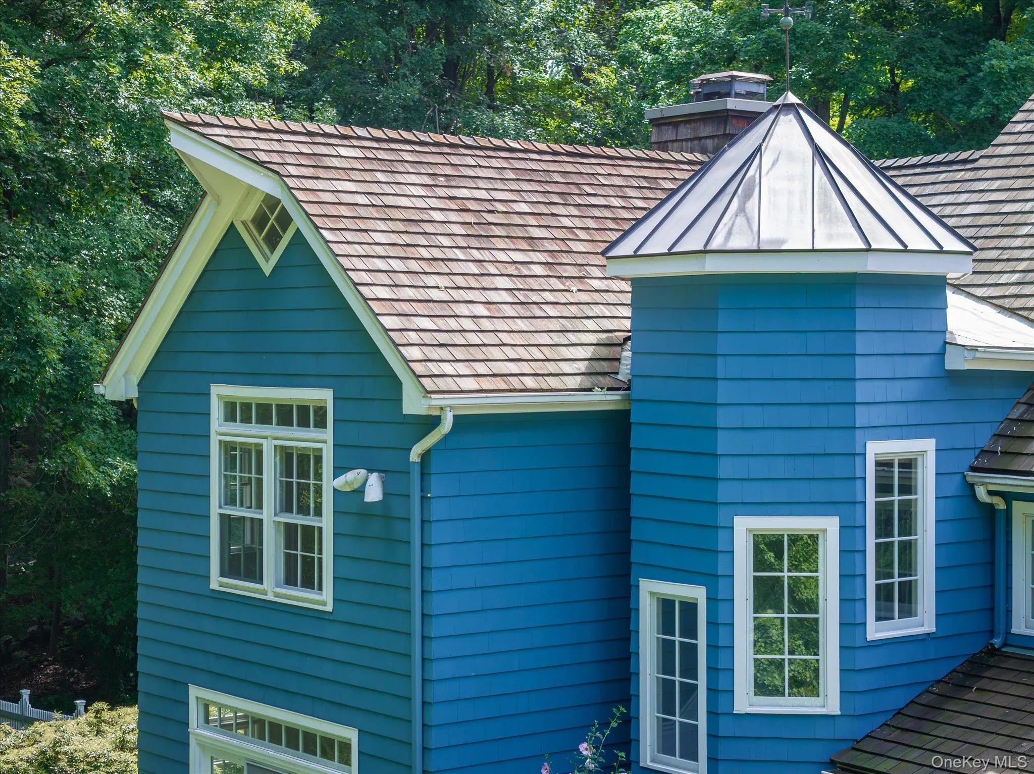Cedar shingle multidimensional roof line & copper roof turret Cedar shingle multidimensional roof line & copper roof turret