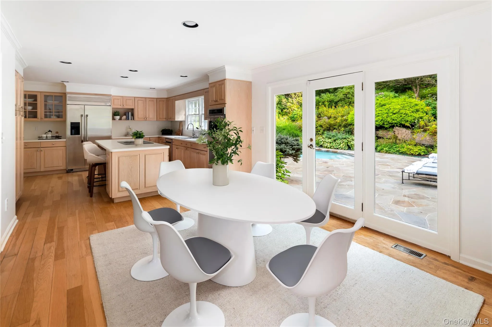 Showing large eat-in area with doors to rear property and pool Showing large eat-in area with doors to rear property and pool