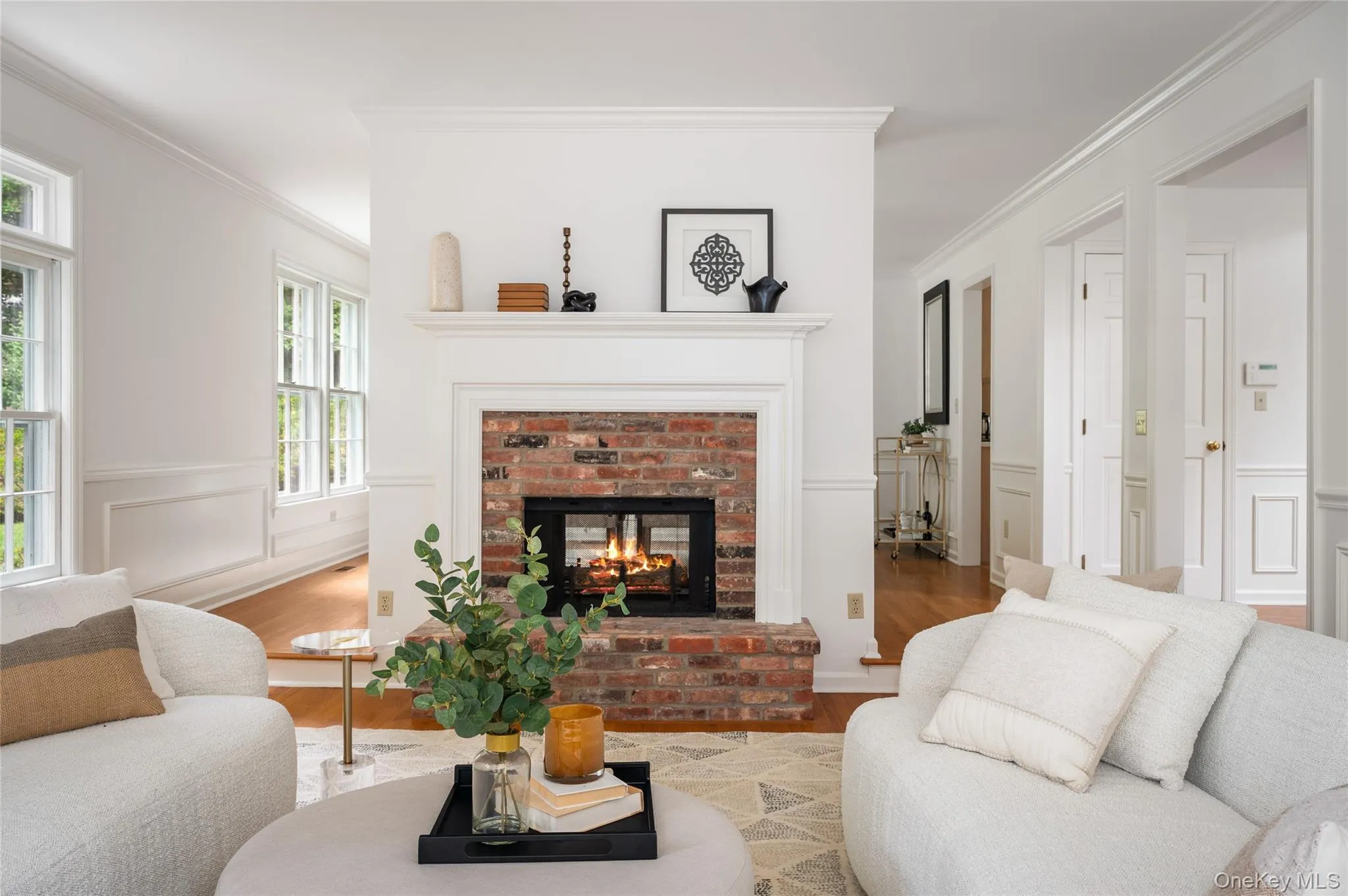 Formal living room with double sided fireplace, formal dinning room beyond Formal living room with double sided fireplace, formal dinning room beyond