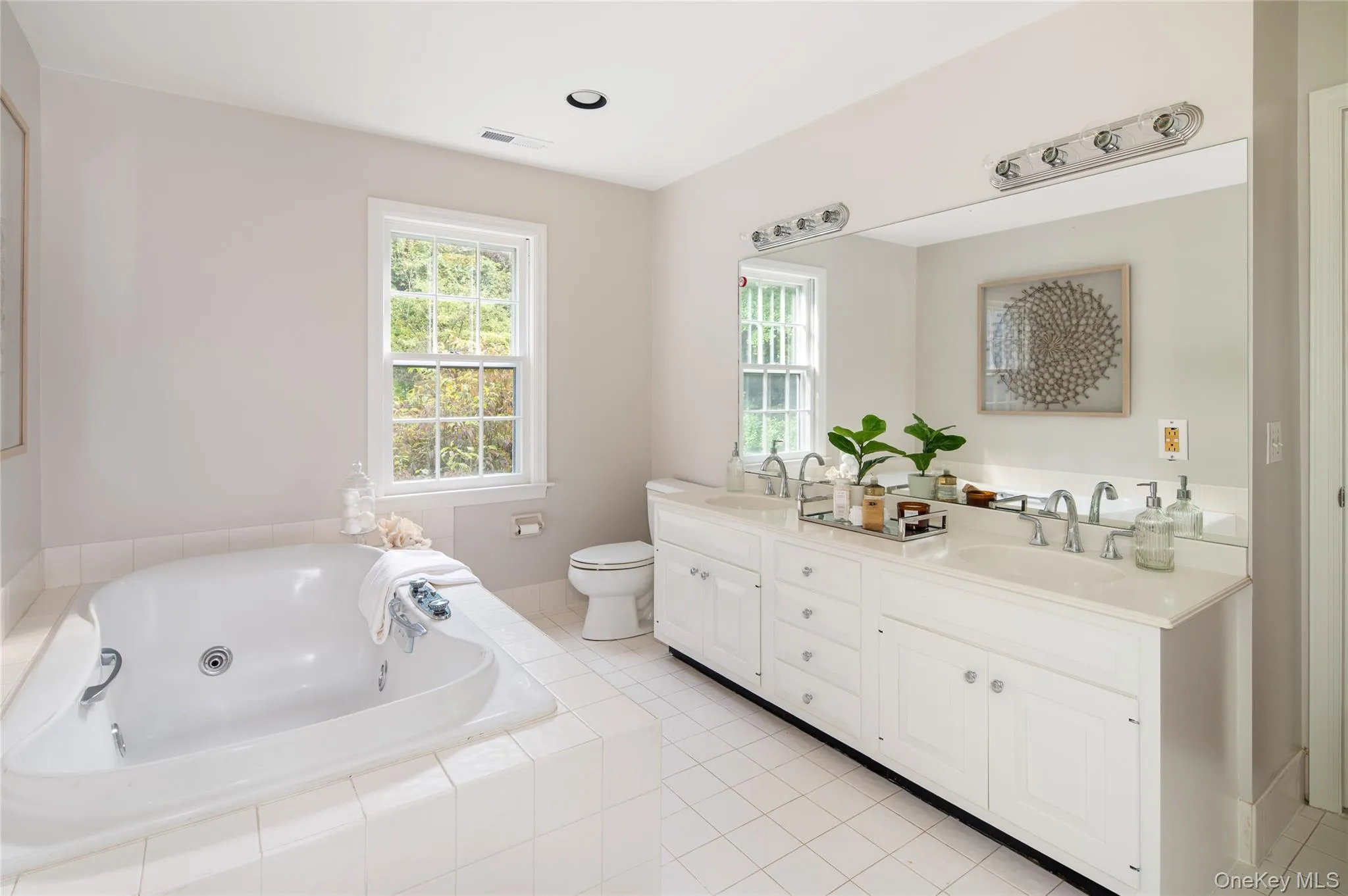 Large soaking tub, double vanity, & separate shower out of view Large soaking tub, double vanity, & separate shower out of view