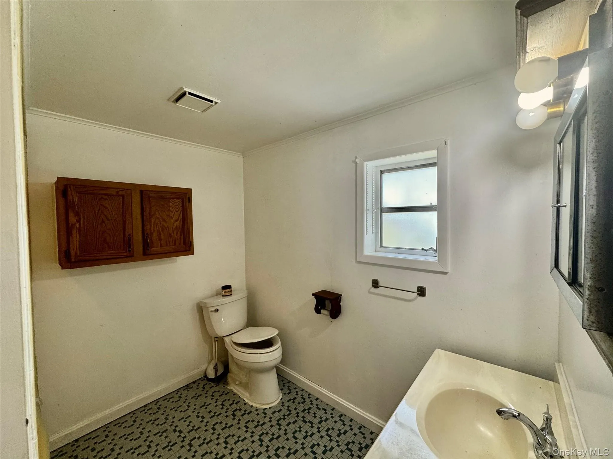 Bathroom with crown molding and vanity Bathroom with crown molding and vanity