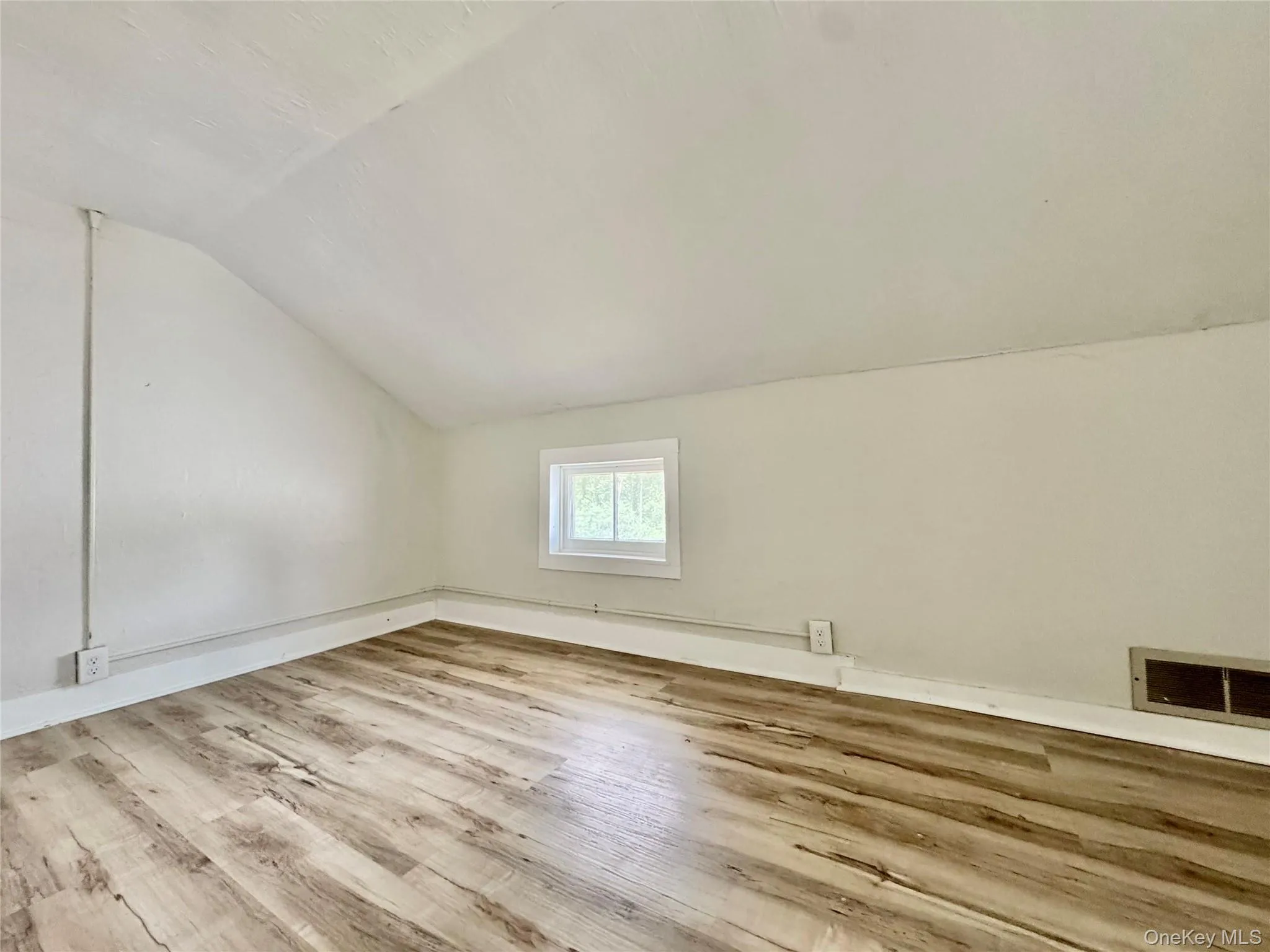 bed room with lofted ceiling and wood finished floors bed room with lofted ceiling and wood finished floors