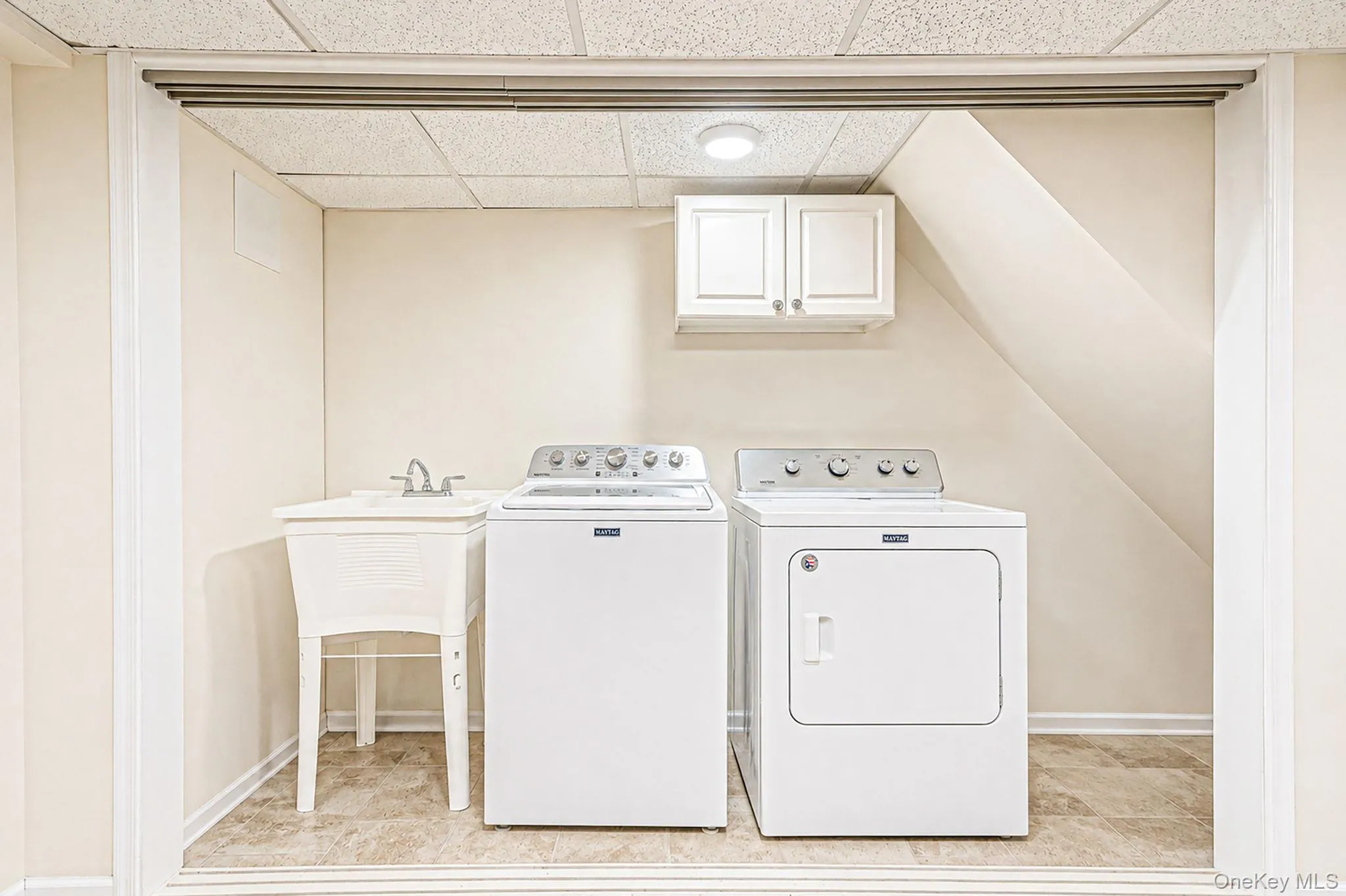 Laundry area with utility sink Laundry area with utility sink