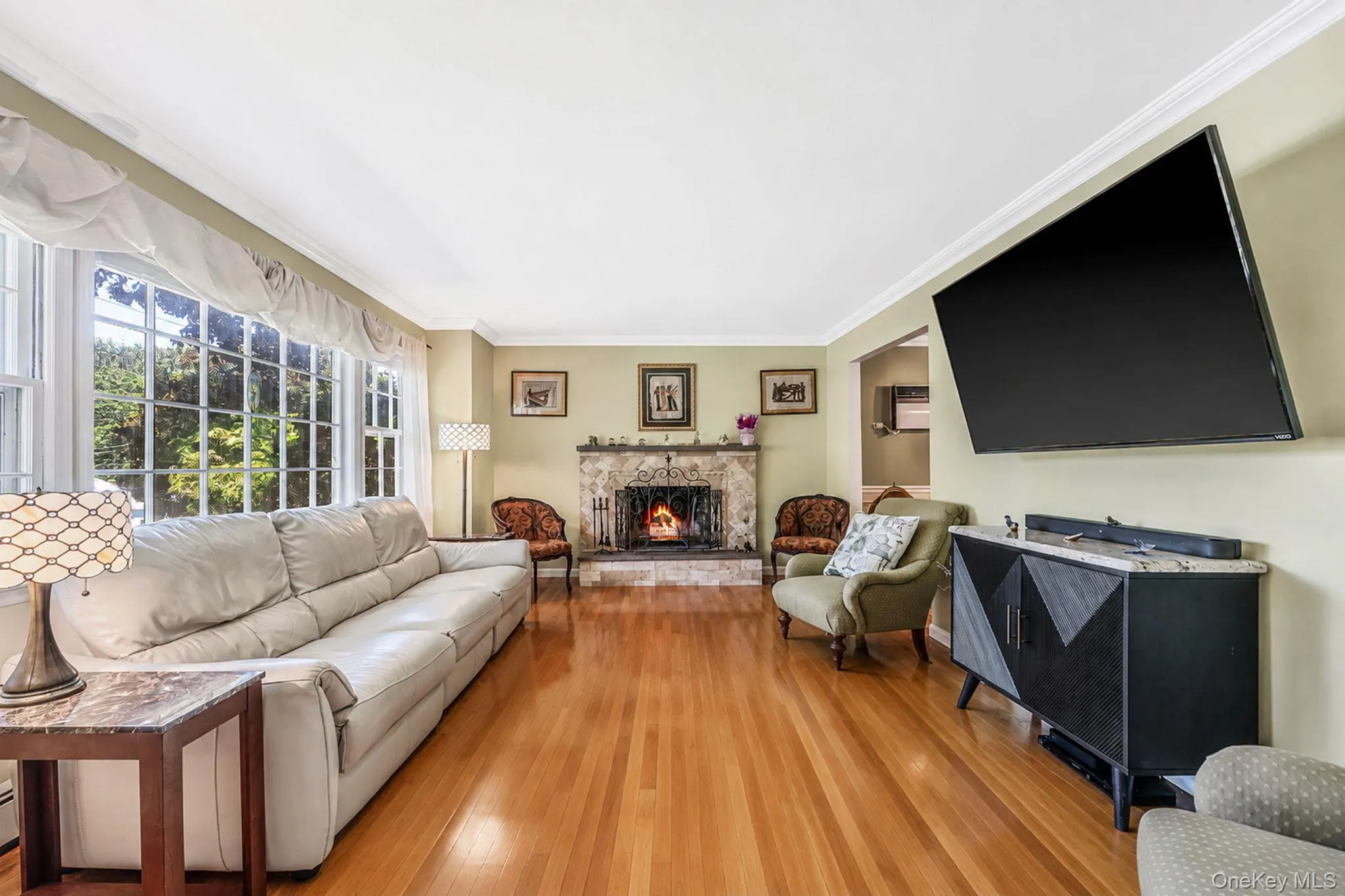Hardwood floors, crown molding, woodburning fireplace Hardwood floors, crown molding, woodburning fireplace