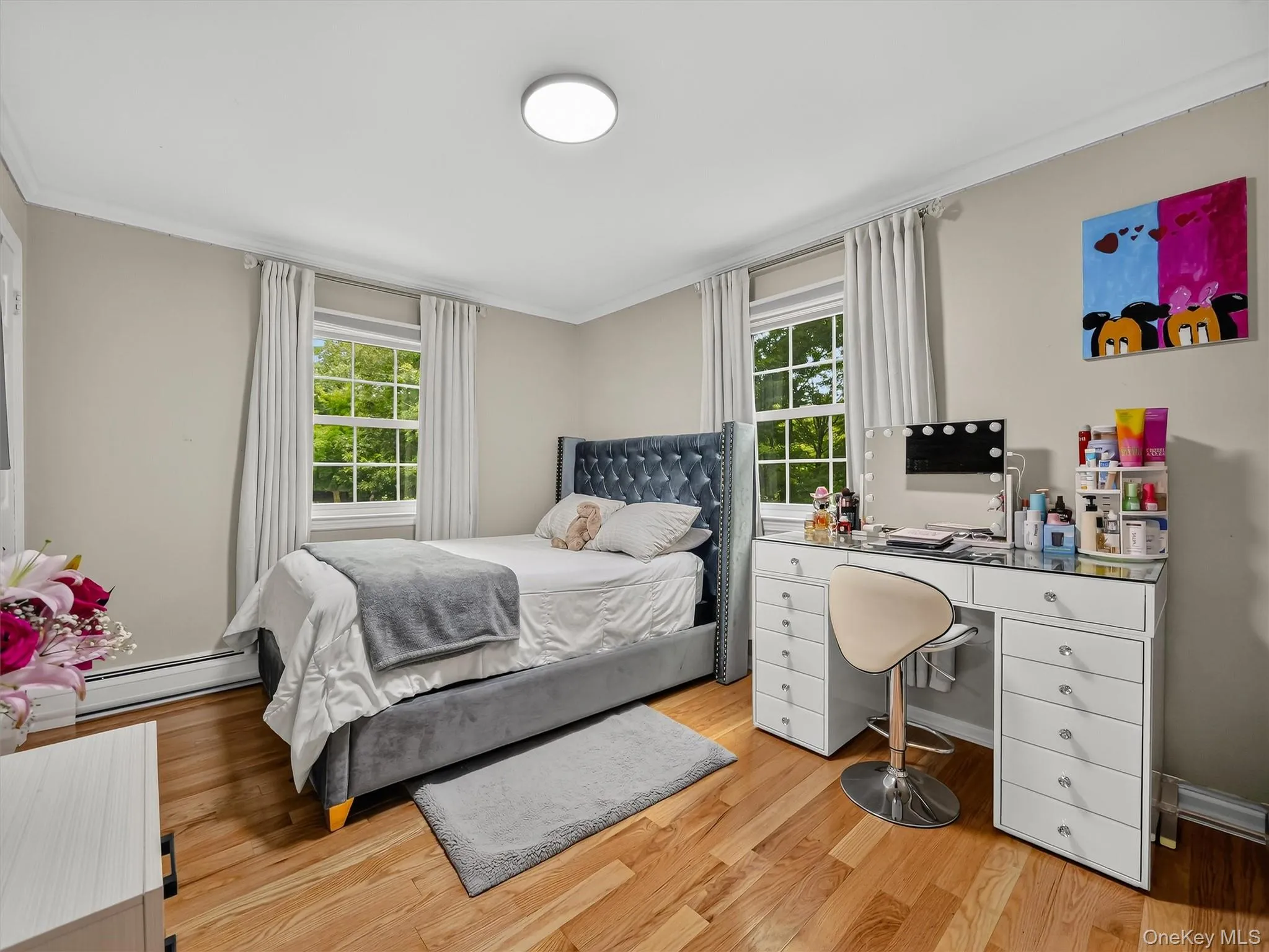 Hardwood flooring complemented by light-toned wall paint Hardwood flooring complemented by light-toned wall paint