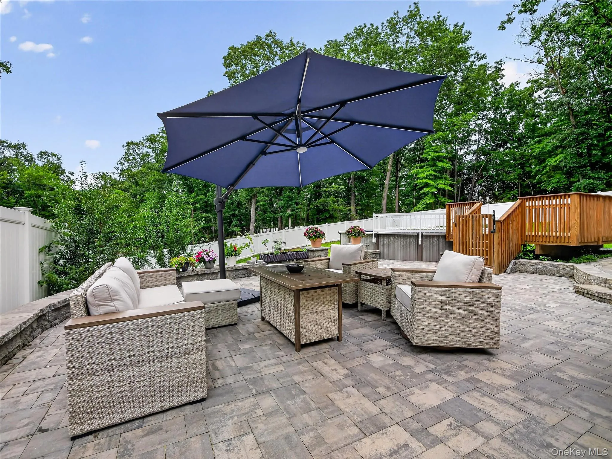 Paver patio an above-ground pool, and a wood deck Paver patio an above-ground pool, and a wood deck