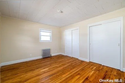 Primary Bedroom with Wall-To-Wall Closets Primary Bedroom with Wall-To-Wall Closets