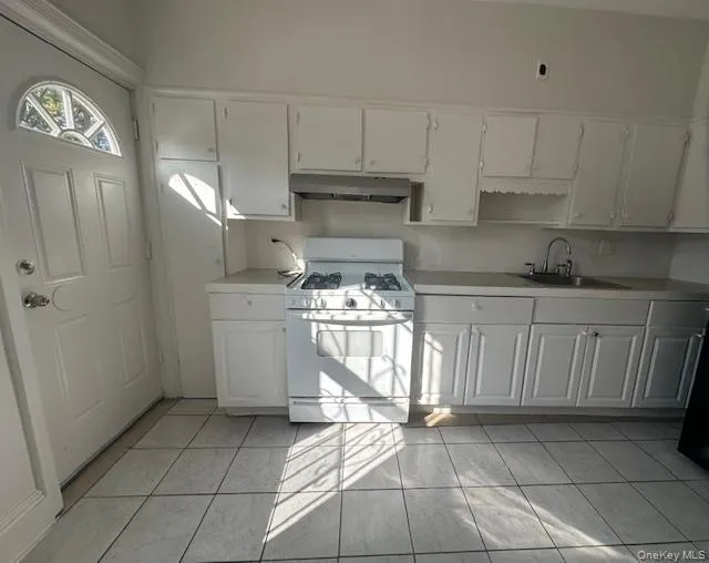 Kitchen with new appliances. Back door leading to porch and backyard Kitchen with new appliances. Back door leading to porch and backyard