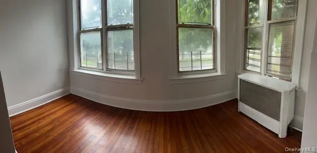 Panoramic view of sunroom right next to another room Panoramic view of sunroom right next to another room