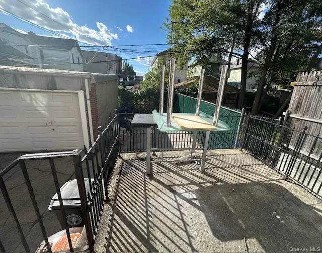 Patio right outside the kitchen, leading to backyard. Patio right outside the kitchen, leading to backyard.