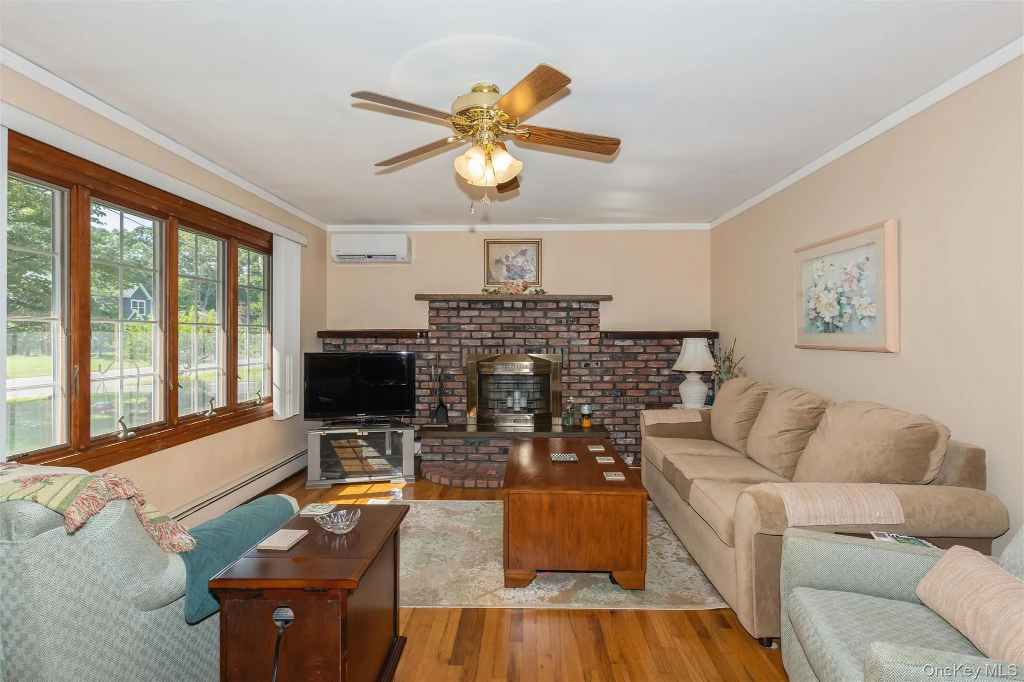 Off the entry foyer is the large living room with Andersen casement windows and a wood burning fireplace too! Off the entry foyer is the large living room with Andersen casement windows and a wood burning fireplace too!