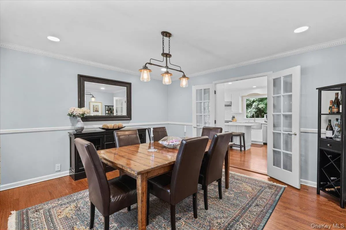 Generously sized dining room with glass doors. Generously sized dining room with glass doors.