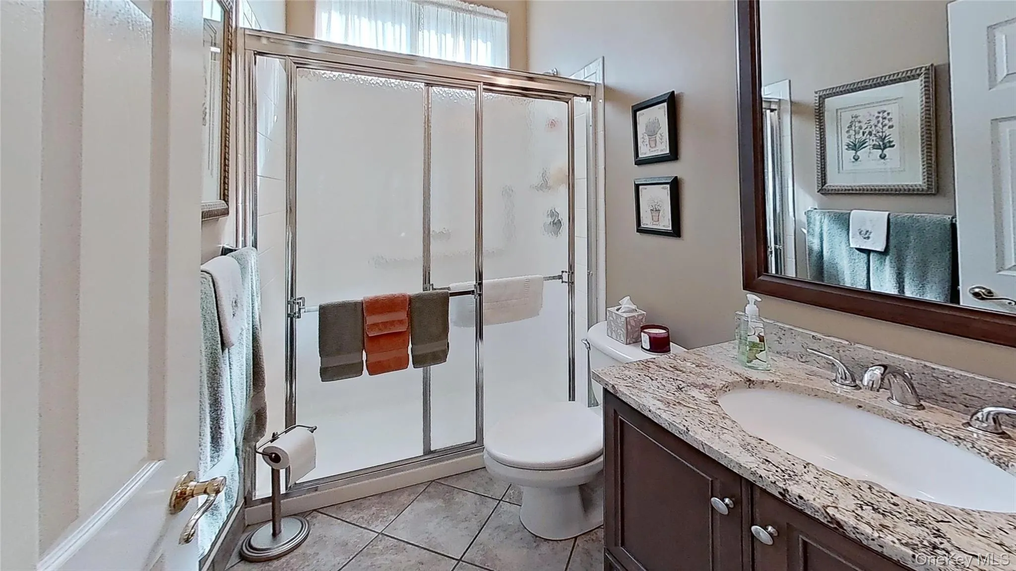 Ideal for guests, this bathroom's walk-in shower is conveniently located! Ideal for guests, this bathroom's walk-in shower is conveniently located!