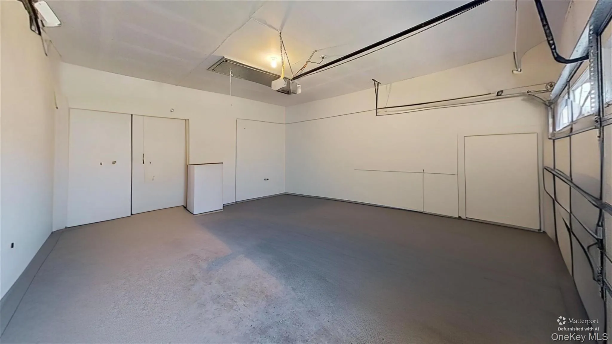This unfurnished picture promotes all the space the BIG TWO CAR GARAGE offers! Electric door opener too! This unfurnished picture promotes all the space the BIG TWO CAR GARAGE offers! Electric door opener too!