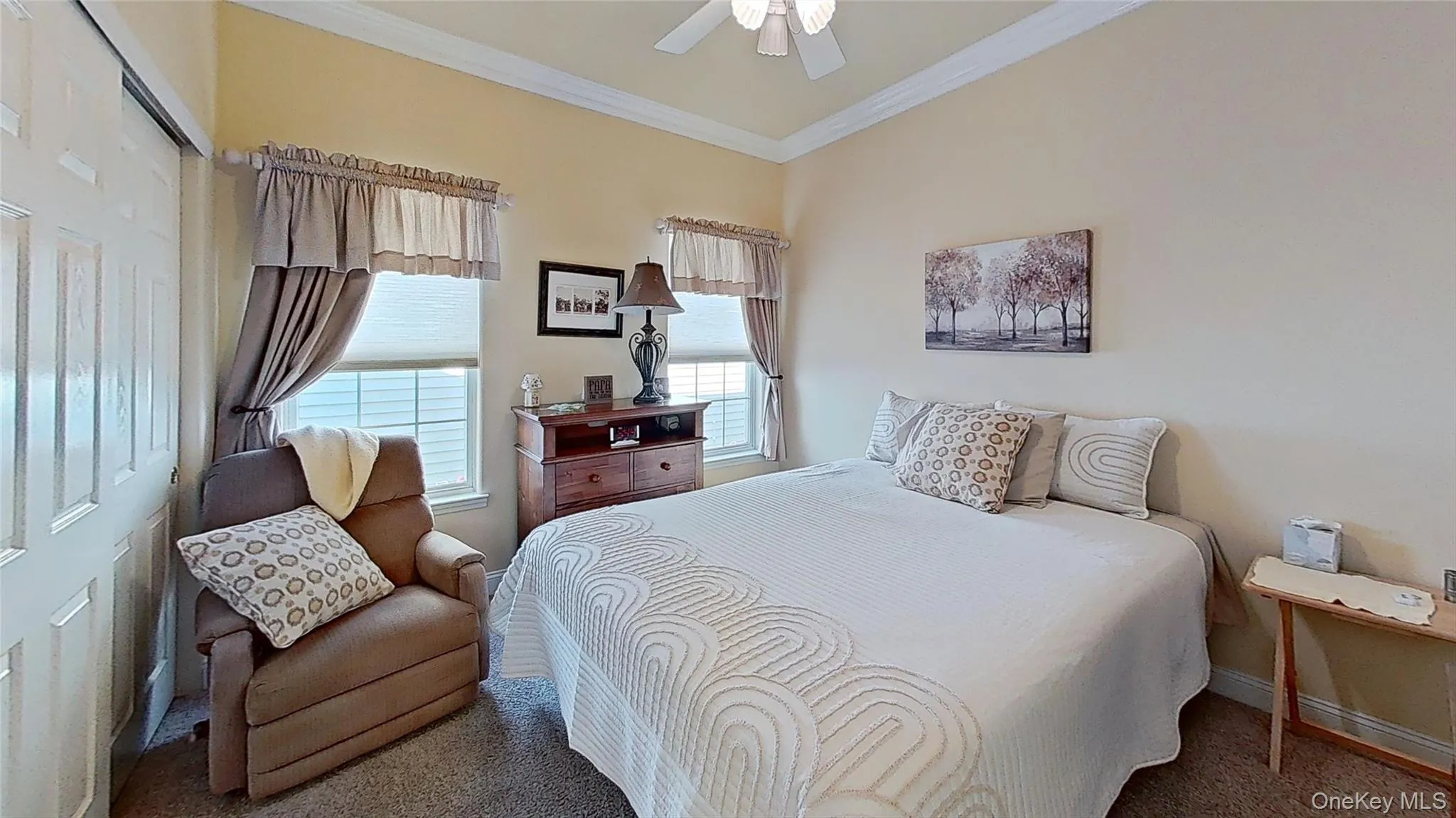 2nd bedroom features plenty of space and closets, plus two windows, crown molding, and a custom ceiling fan! 2nd bedroom features plenty of space and closets, plus two windows, crown molding, and a custom ceiling fan!