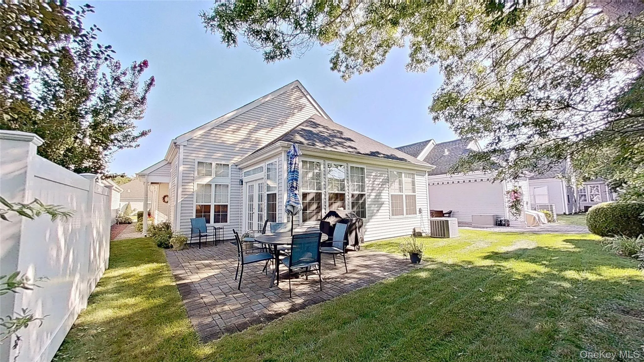 The paver patio and surrounding lawn with a privacy fence and stately landscaping are ideal for outside gatherings. The paver patio and surrounding lawn with a privacy fence and stately landscaping are ideal for outside gatherings.