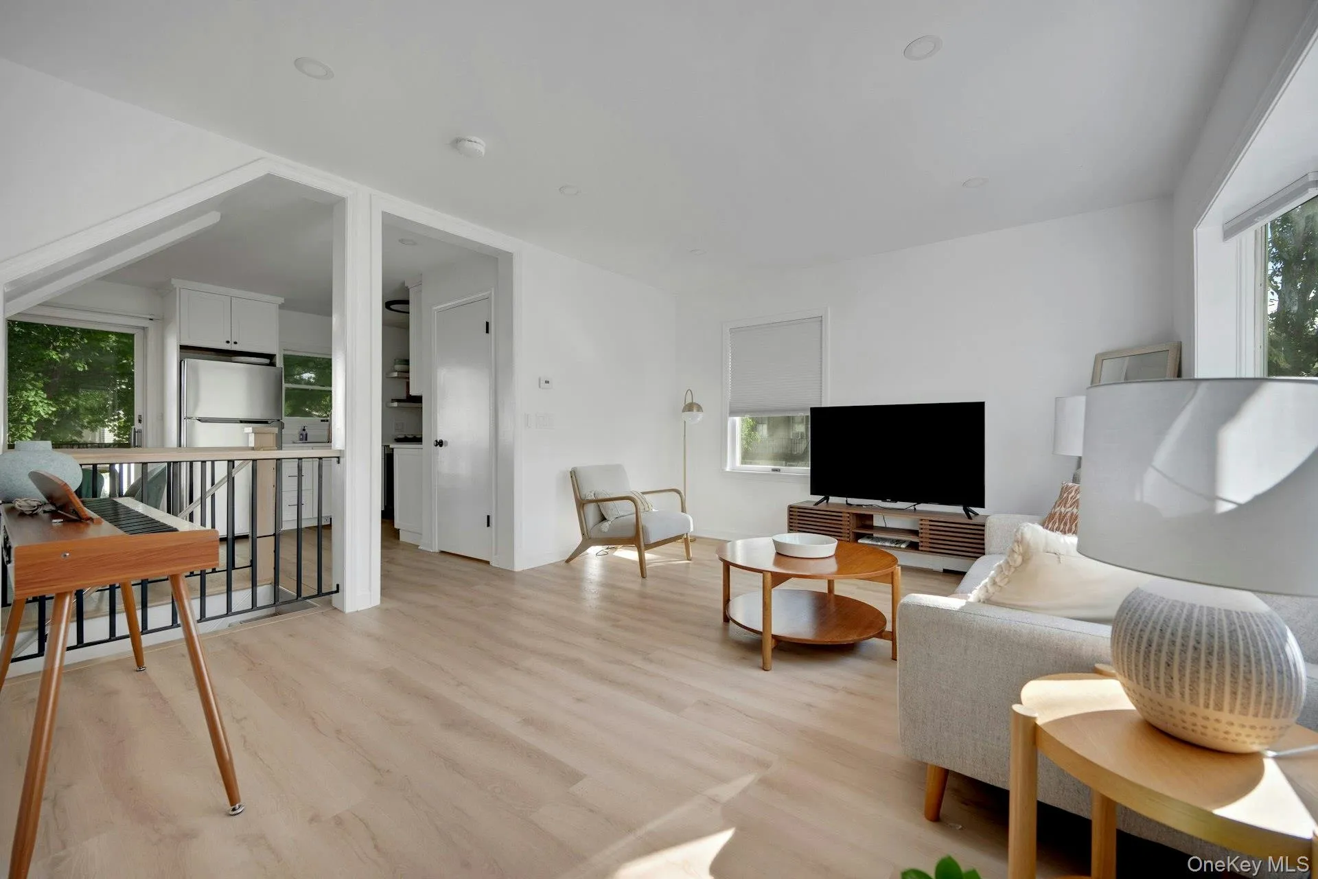 Opens to kitchen and dining area... Opens to kitchen and dining area...