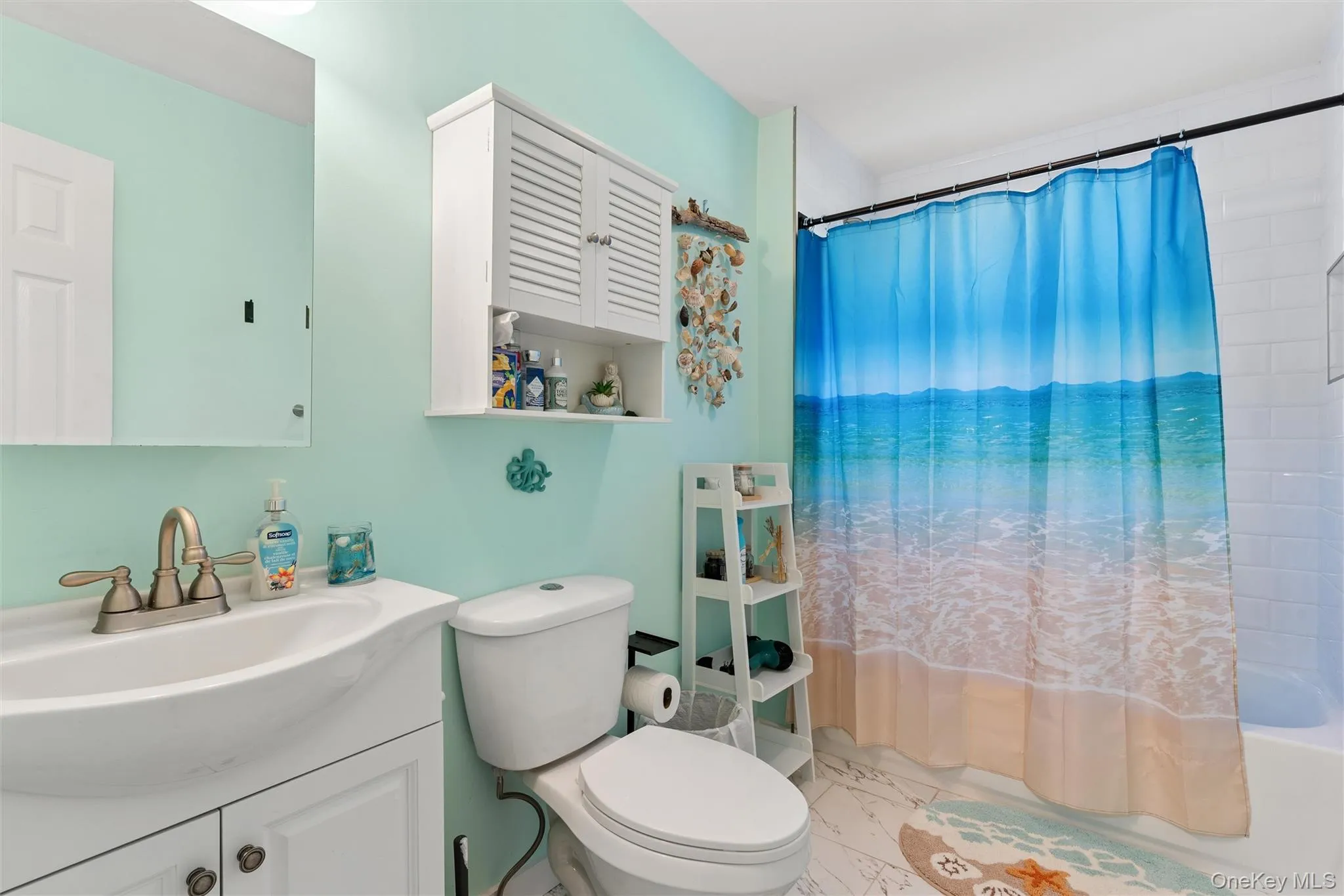 White vanity with integrated sink and brushed nickel faucet White vanity with integrated sink and brushed nickel faucet