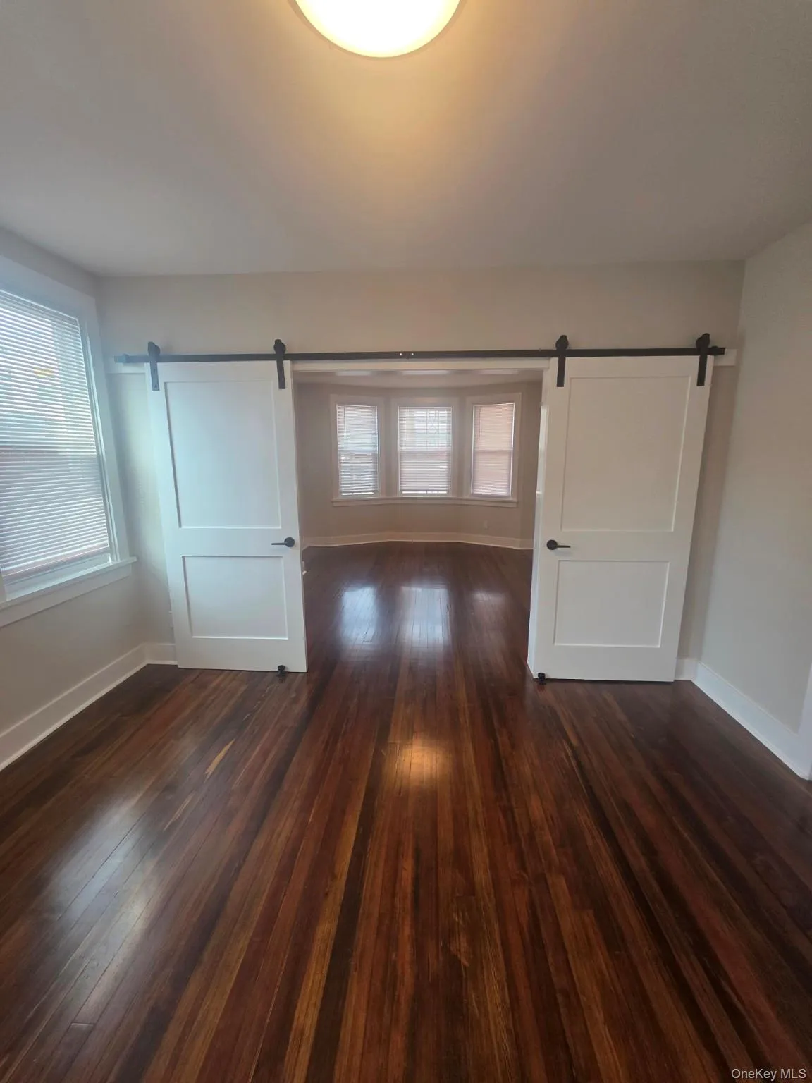 View of barn doors into primary bedroom View of barn doors into primary bedroom