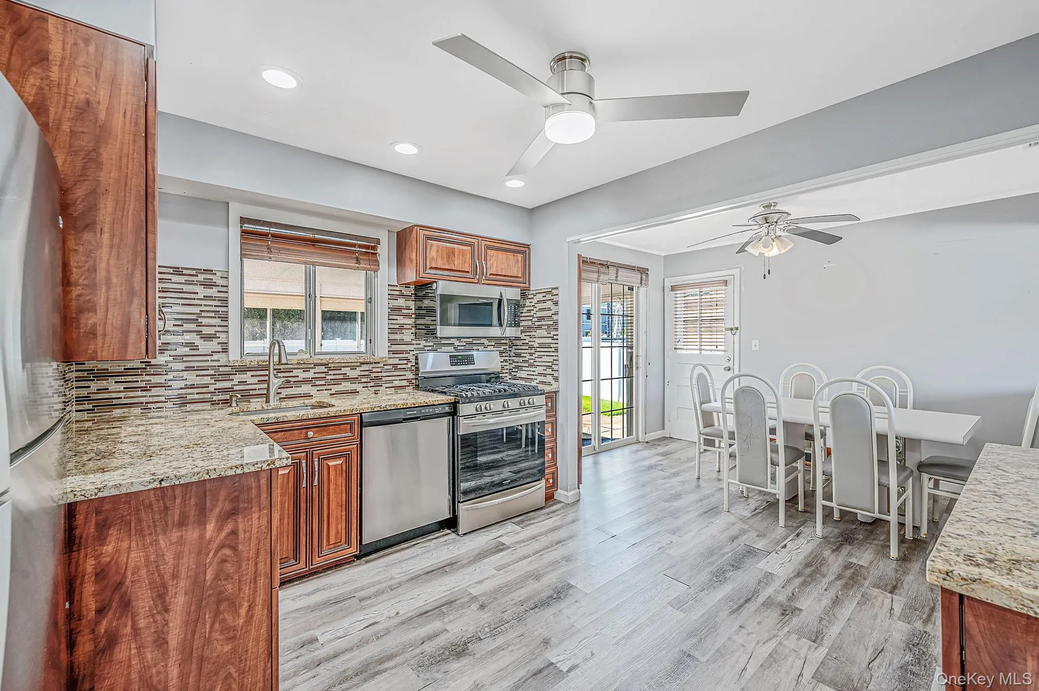 Updated EIK with SS Appliances, Gas Cooking, Large Dining Area, Sliders to Sunroom Updated EIK with SS Appliances, Gas Cooking, Large Dining Area, Sliders to Sunroom