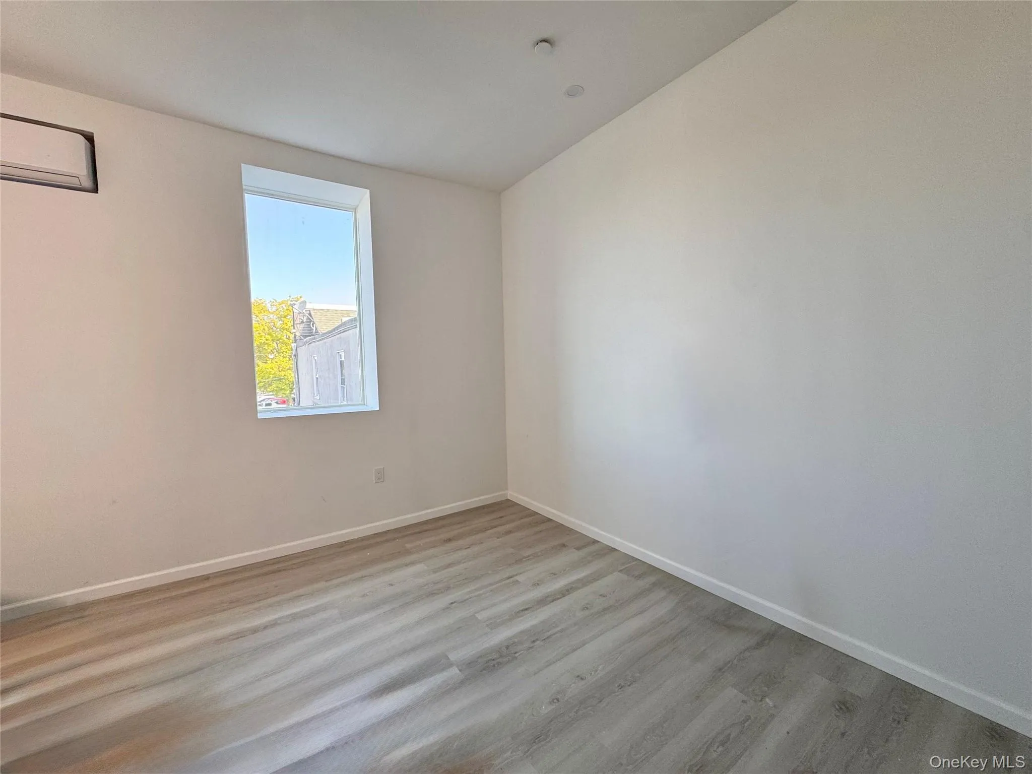 Living Room has AC wall unit Living Room has AC wall unit