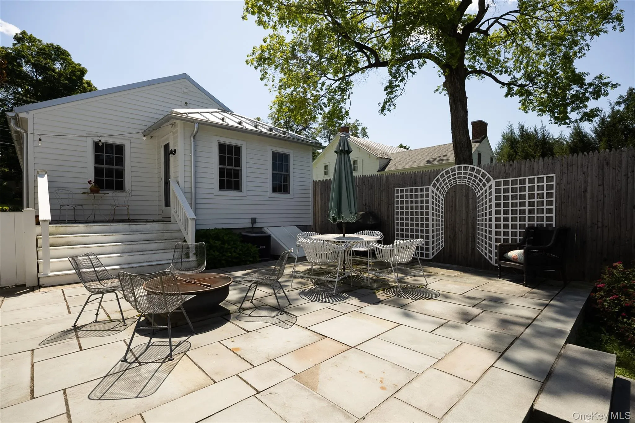 Rear of home with deck and terrace. Rear of home with deck and terrace.