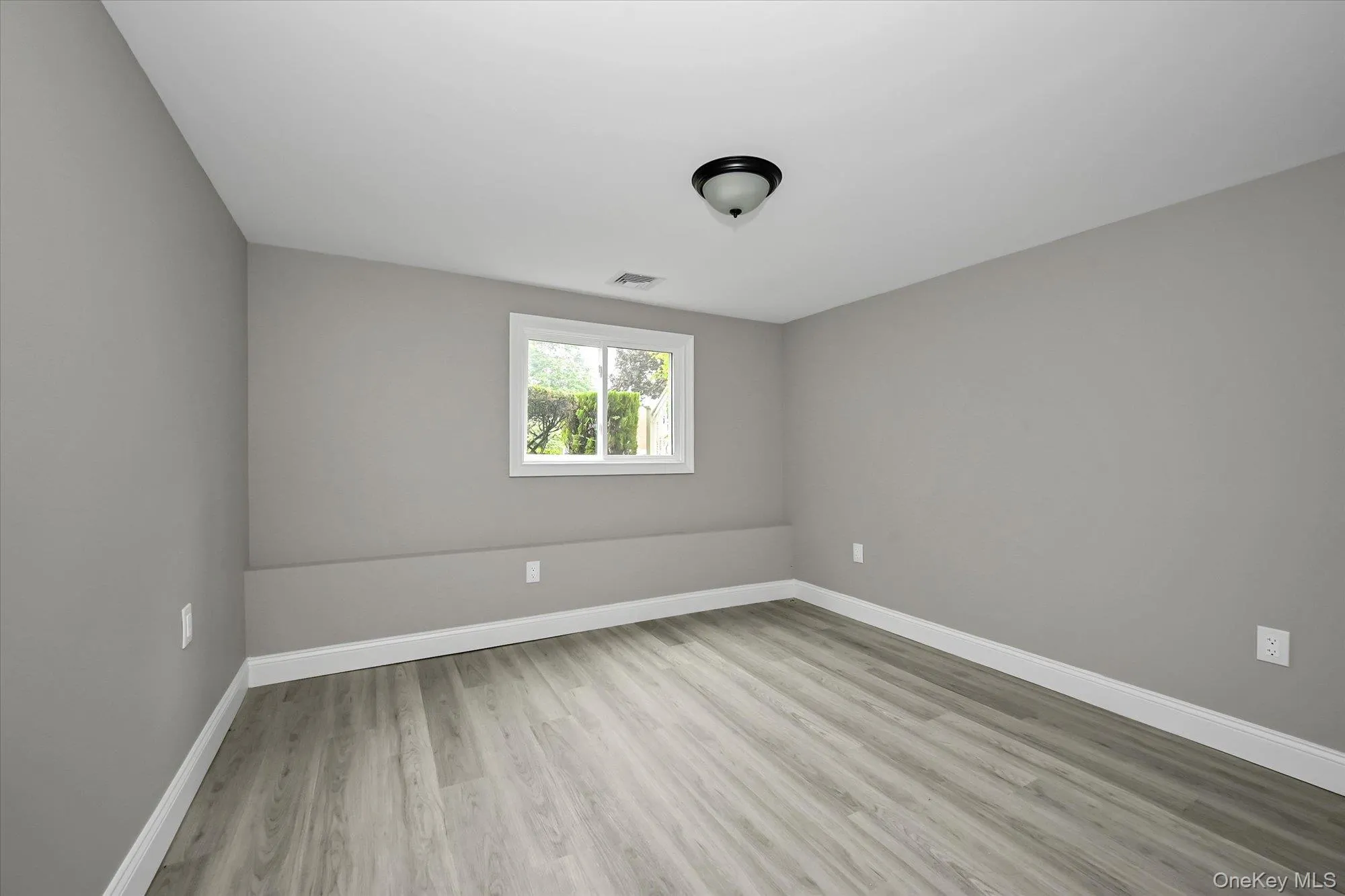 Lower Level 1st Bedroom, with Access to Backyard Patio , Lower level Bathroom, and Garage Lower Level 1st Bedroom, with Access to Backyard Patio , Lower level Bathroom, and Garage