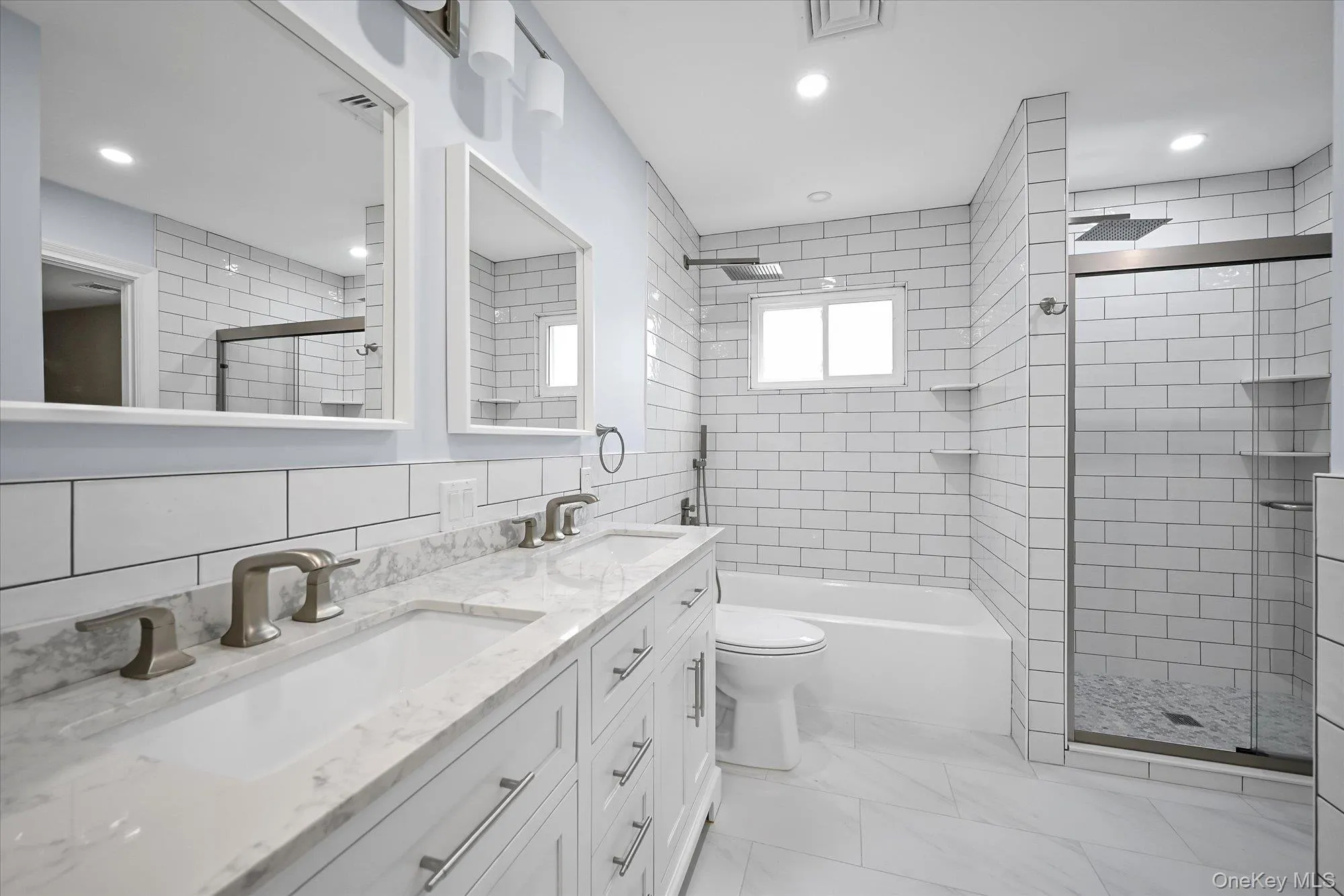 Full Hall Bathroom with Separate Tub/shower with shower system and Separate step in shower. Double Vanity sink and Linen Closet. Full Hall Bathroom with Separate Tub/shower with shower system and Separate step in shower. Double Vanity sink and Linen Closet.