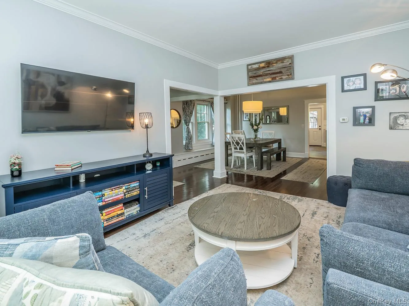 Living Room with lots of natural light, wood floors and interior trim Living Room with lots of natural light, wood floors and interior trim