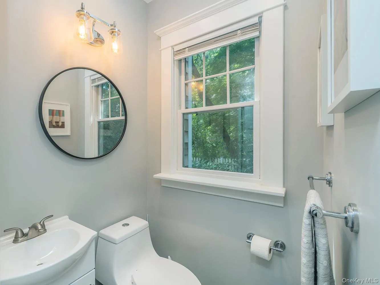 This powder room includes a window that brings in natural light This powder room includes a window that brings in natural light