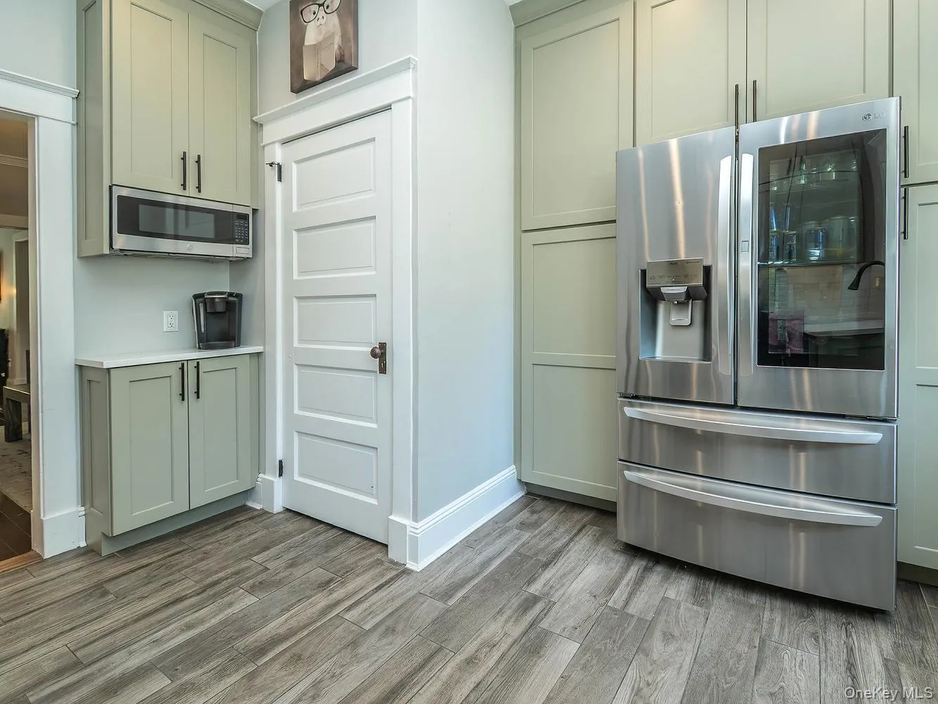 Kitchen with adjoining door to powder room Kitchen with adjoining door to powder room