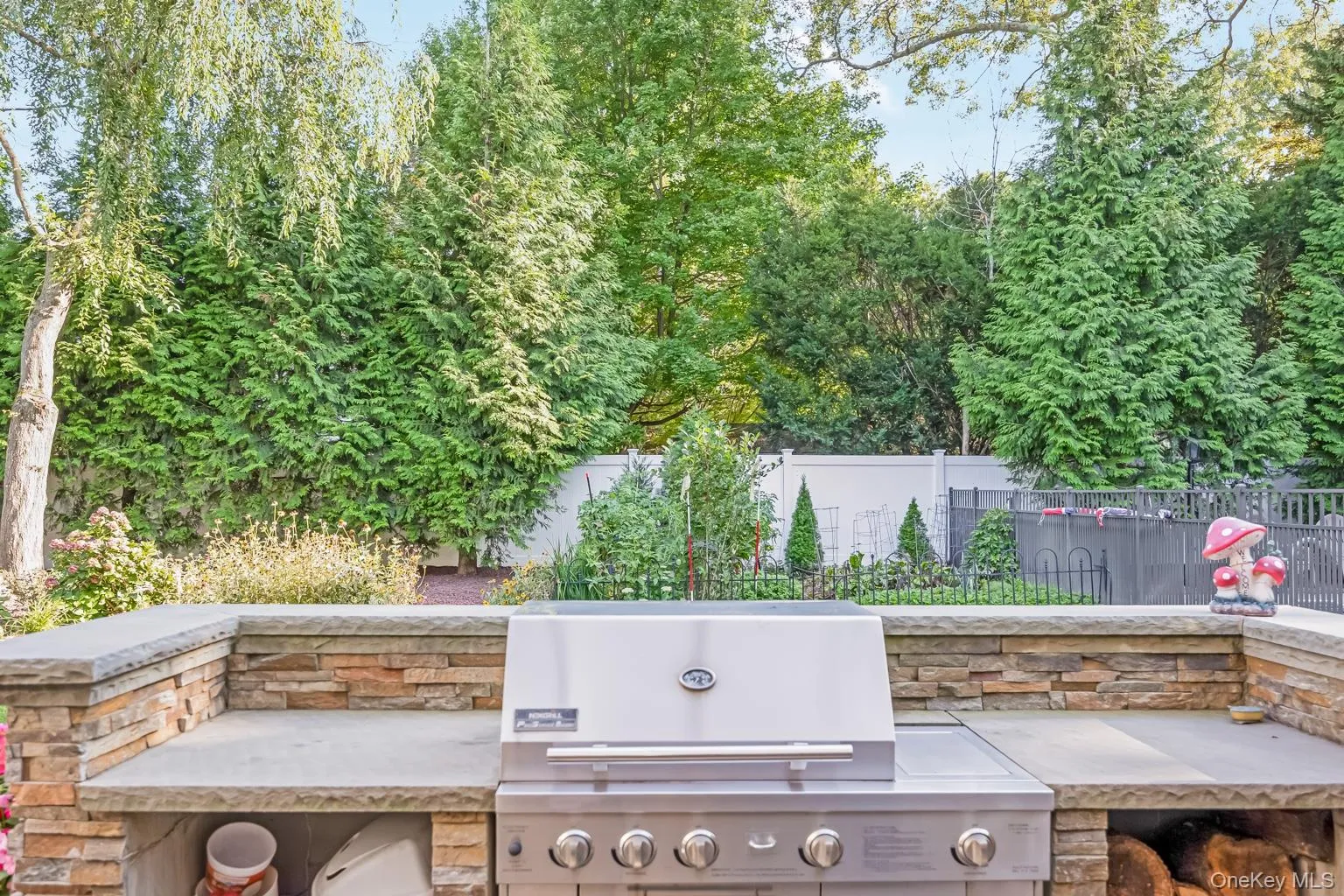Built-in outdoor grill with stone surround and counter space Built-in outdoor grill with stone surround and counter space