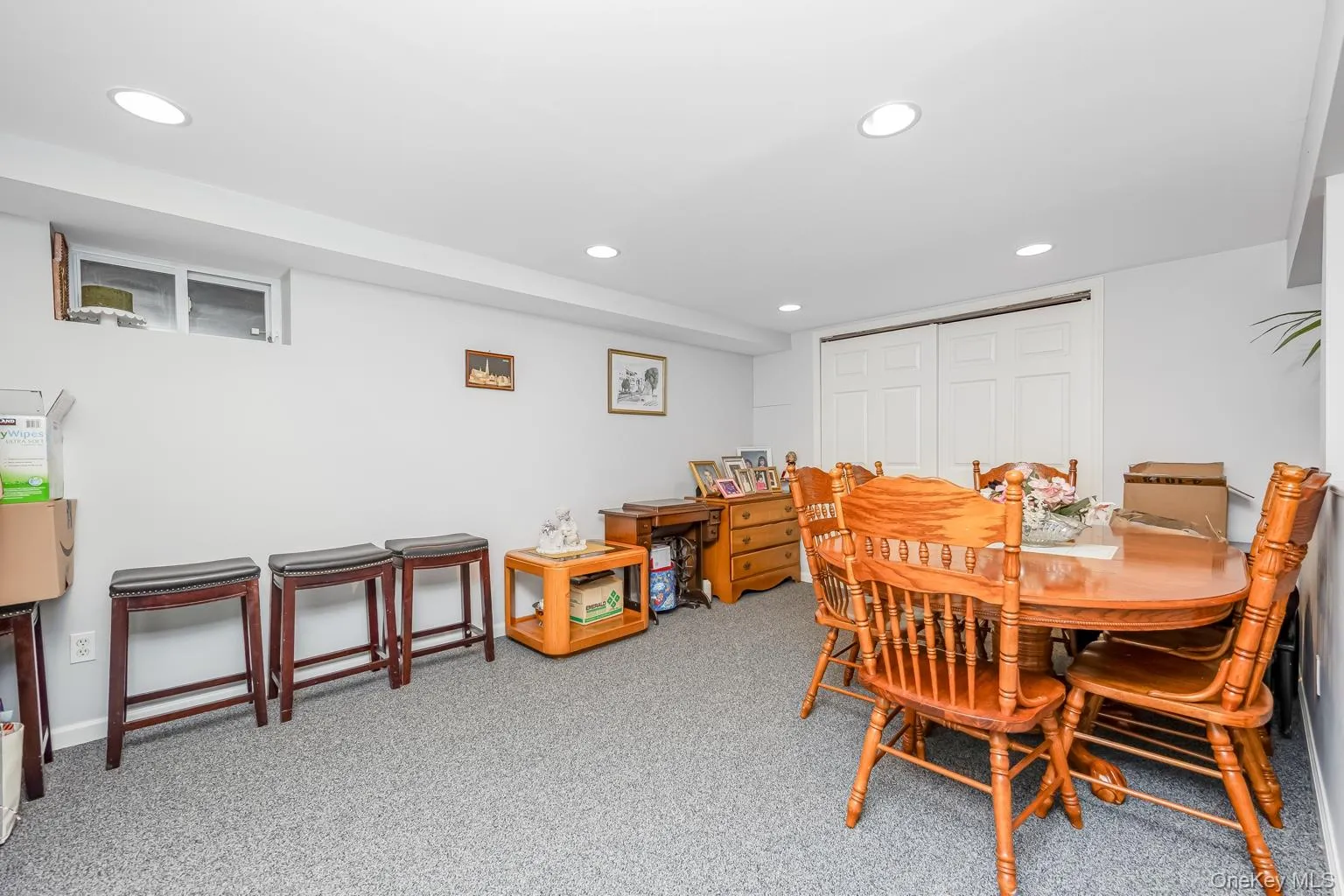 Recessed lighting, light-toned walls, and carpet flooring Recessed lighting, light-toned walls, and carpet flooring