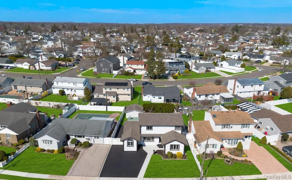 Aerial perspective showcasing a residential neighborhood with diverse housing styles Aerial perspective showcasing a residential neighborhood with diverse housing styles