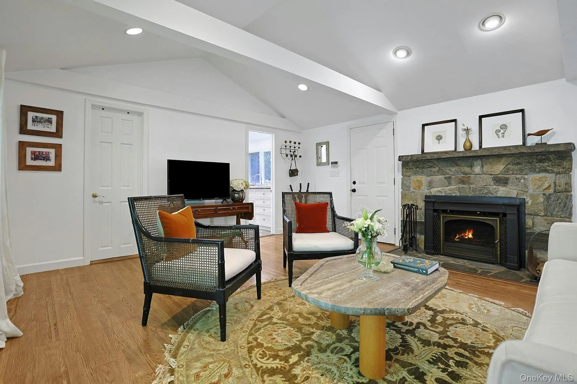 After the walls of windows, the beamed ceiling and the fireplace are the central architectural features of the room. After the walls of windows, the beamed ceiling and the fireplace are the central architectural features of the room.
