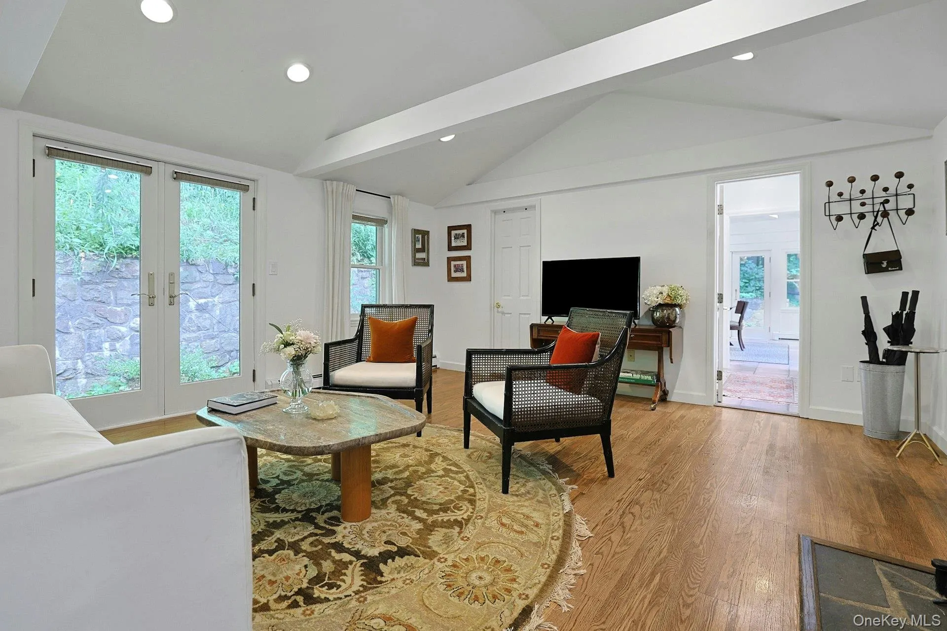 From the great room, one can pass through to the dining room or directly out to the grounds at the rear. From the great room, one can pass through to the dining room or directly out to the grounds at the rear.