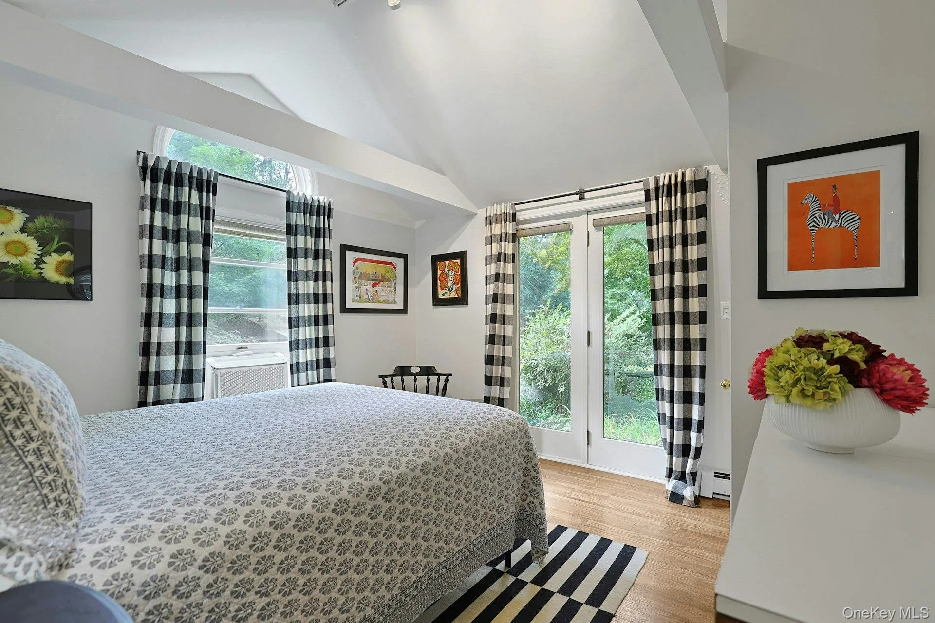 Like its adjacent sister, this bedroom has doors to the gardens. Like its adjacent sister, this bedroom has doors to the gardens.