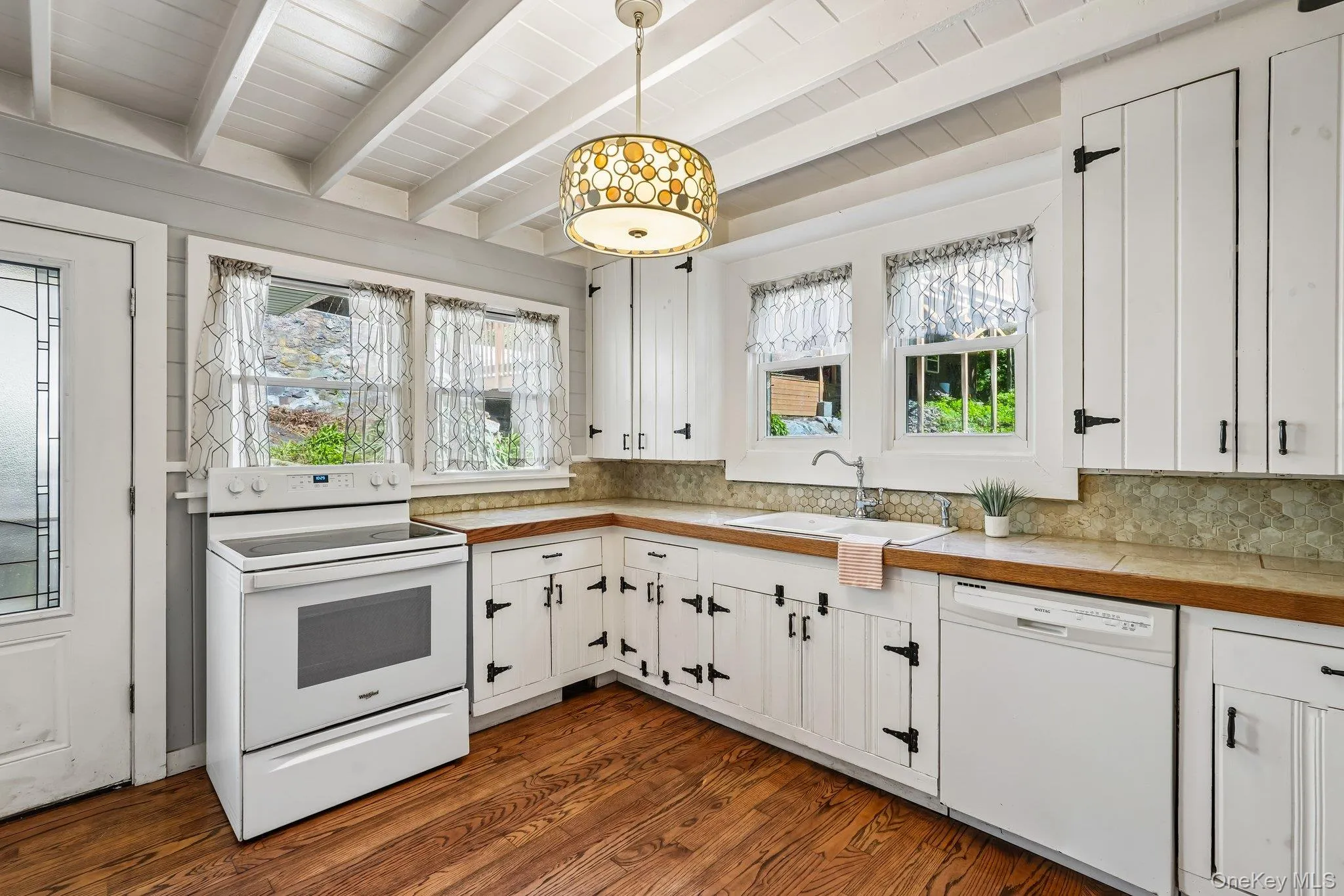 Kitchen/Entryway in House 2 - dishwasher, oven & country cabinetry. Kitchen/Entryway in House 2 - dishwasher, oven & country cabinetry.