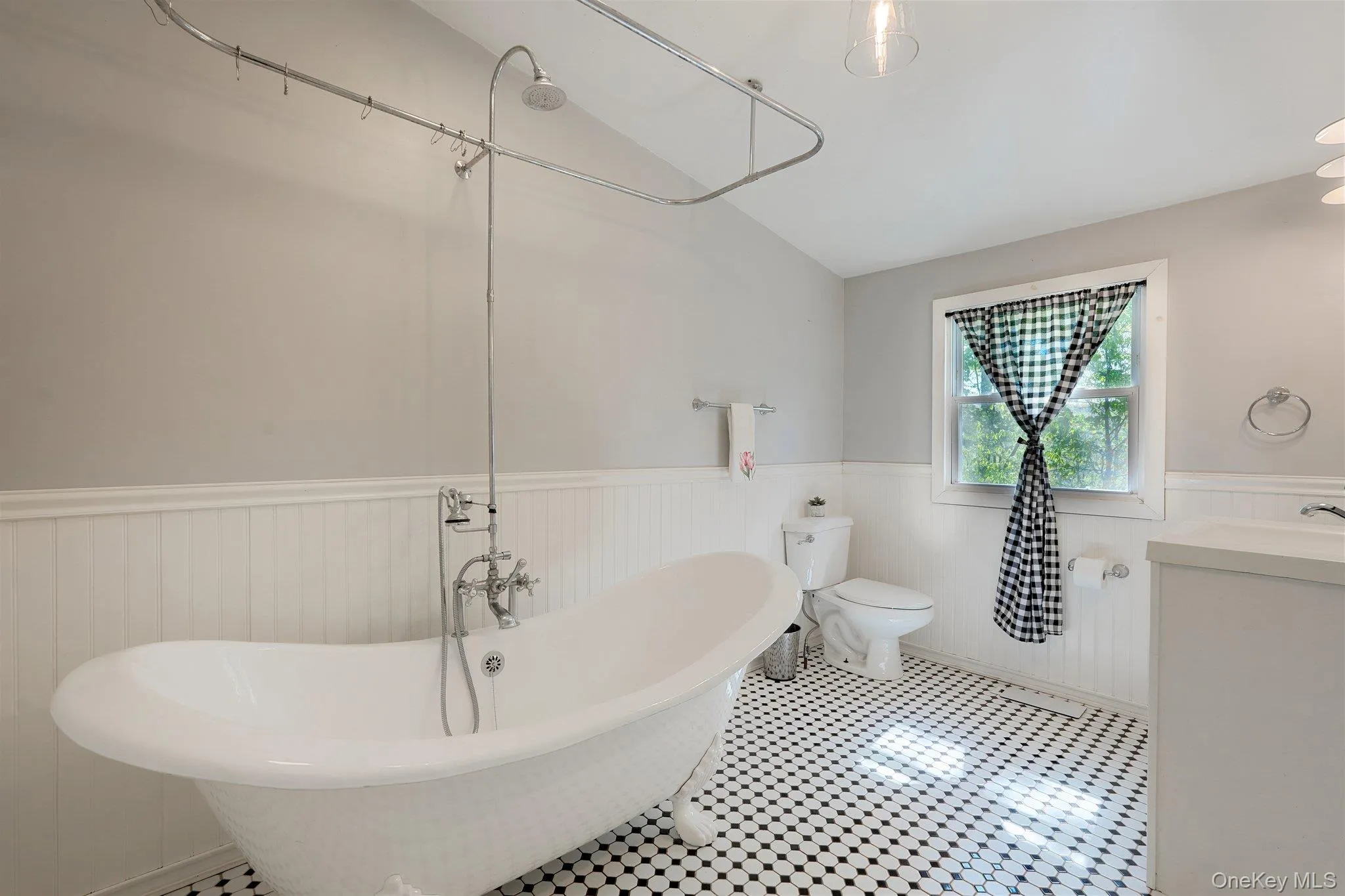 House 2 clawfoot tub with shower, tile floors and vanity. House 2 clawfoot tub with shower, tile floors and vanity.
