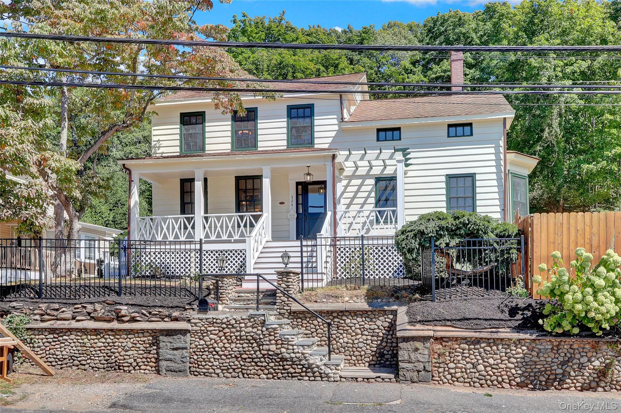 View of front of home featuring a porch and stairway View of front of home featuring a porch and stairway