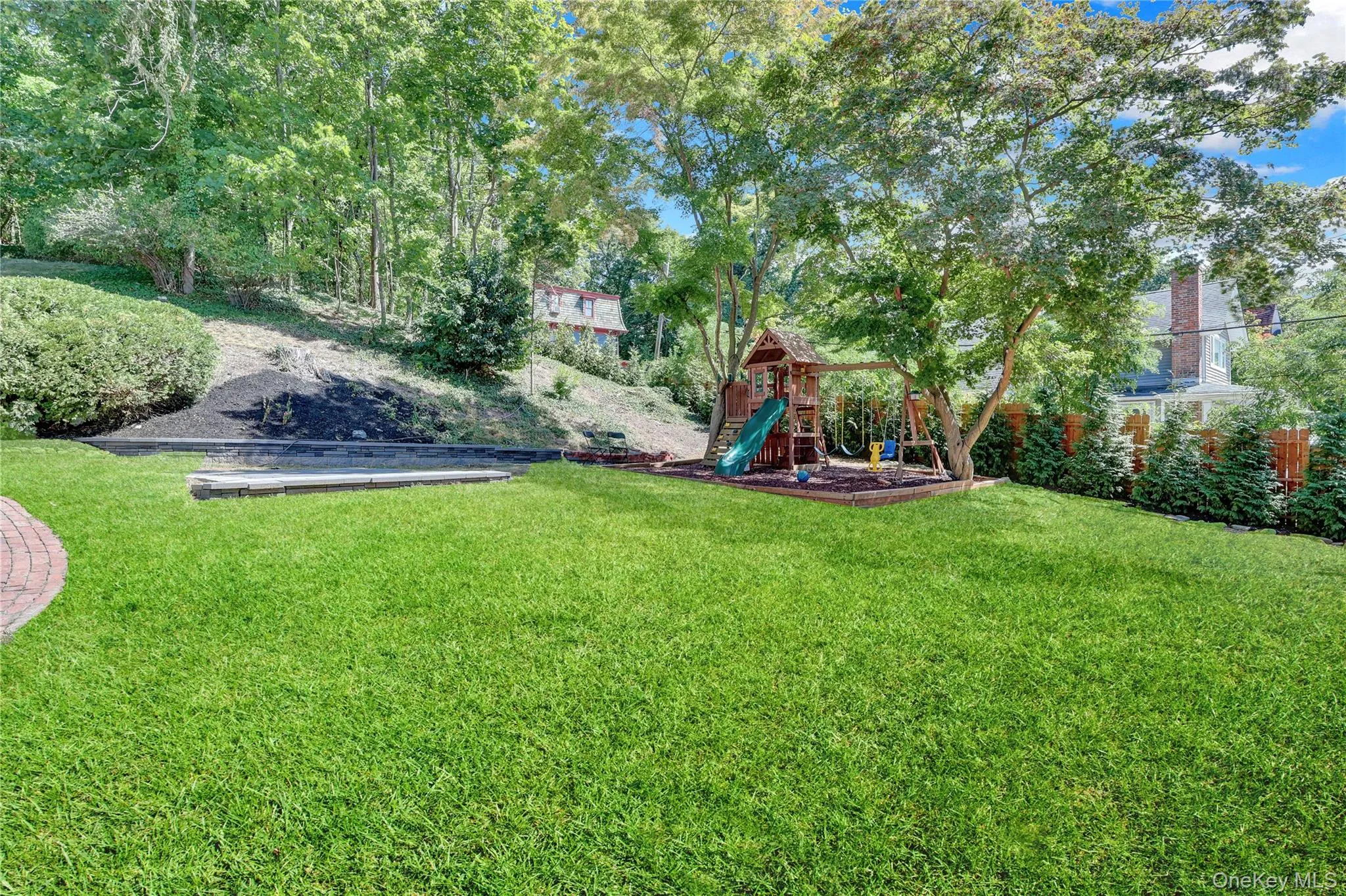 View of grassy yard featuring a playground View of grassy yard featuring a playground