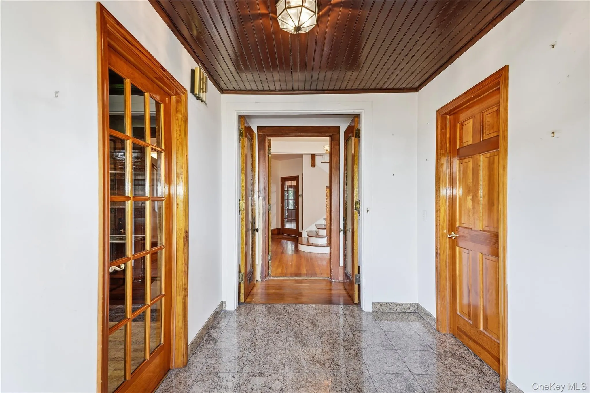 Rich woodwork gives the entry unforgettable historic character Rich woodwork gives the entry unforgettable historic character