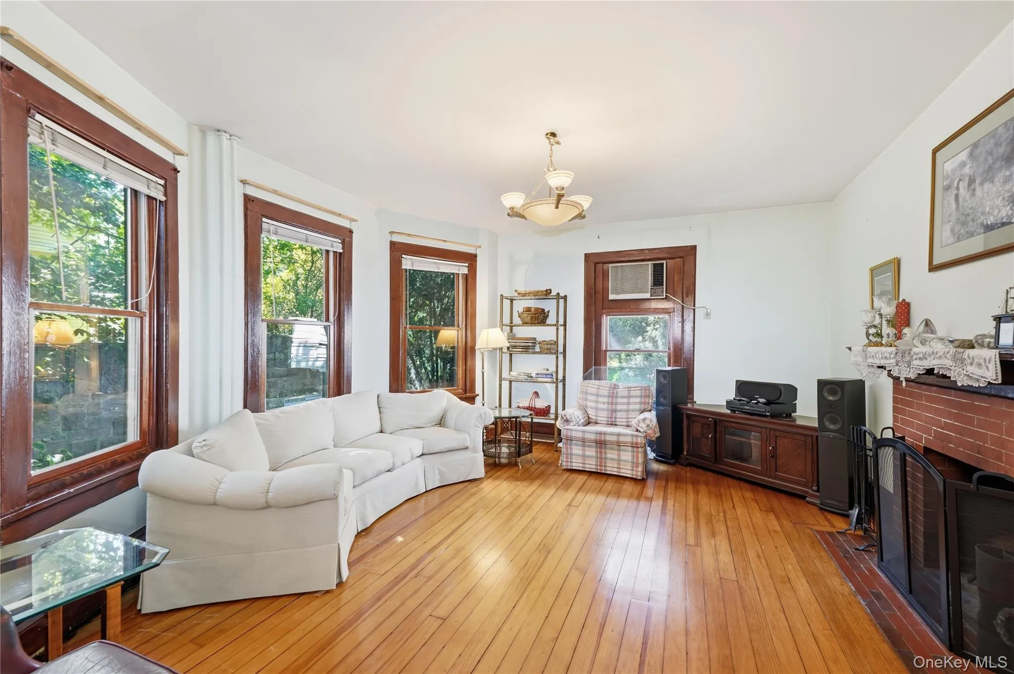 Oversized windows fill the living room with natural light Oversized windows fill the living room with natural light