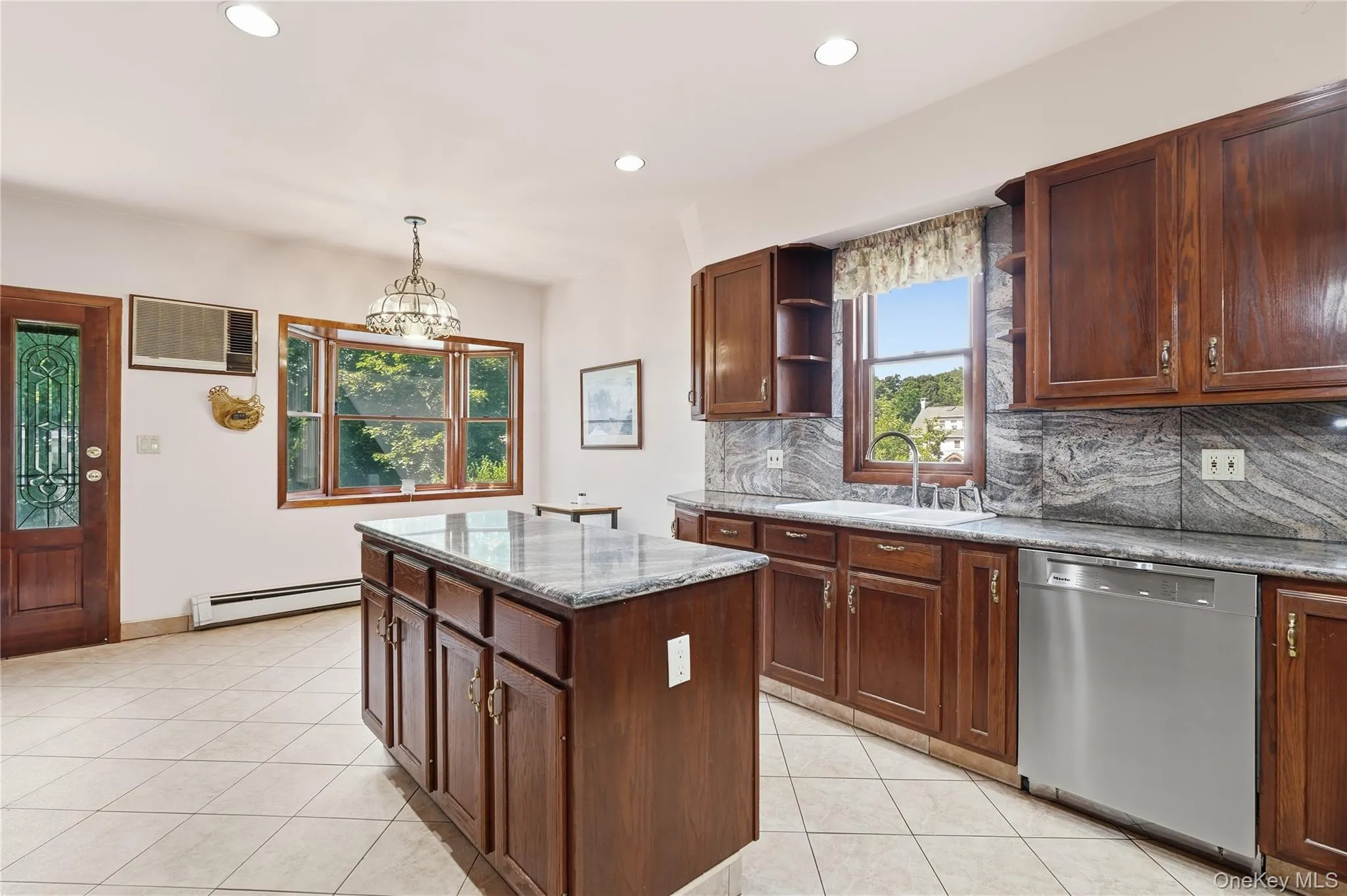 Expansive kitchen island makes entertaining effortless Expansive kitchen island makes entertaining effortless