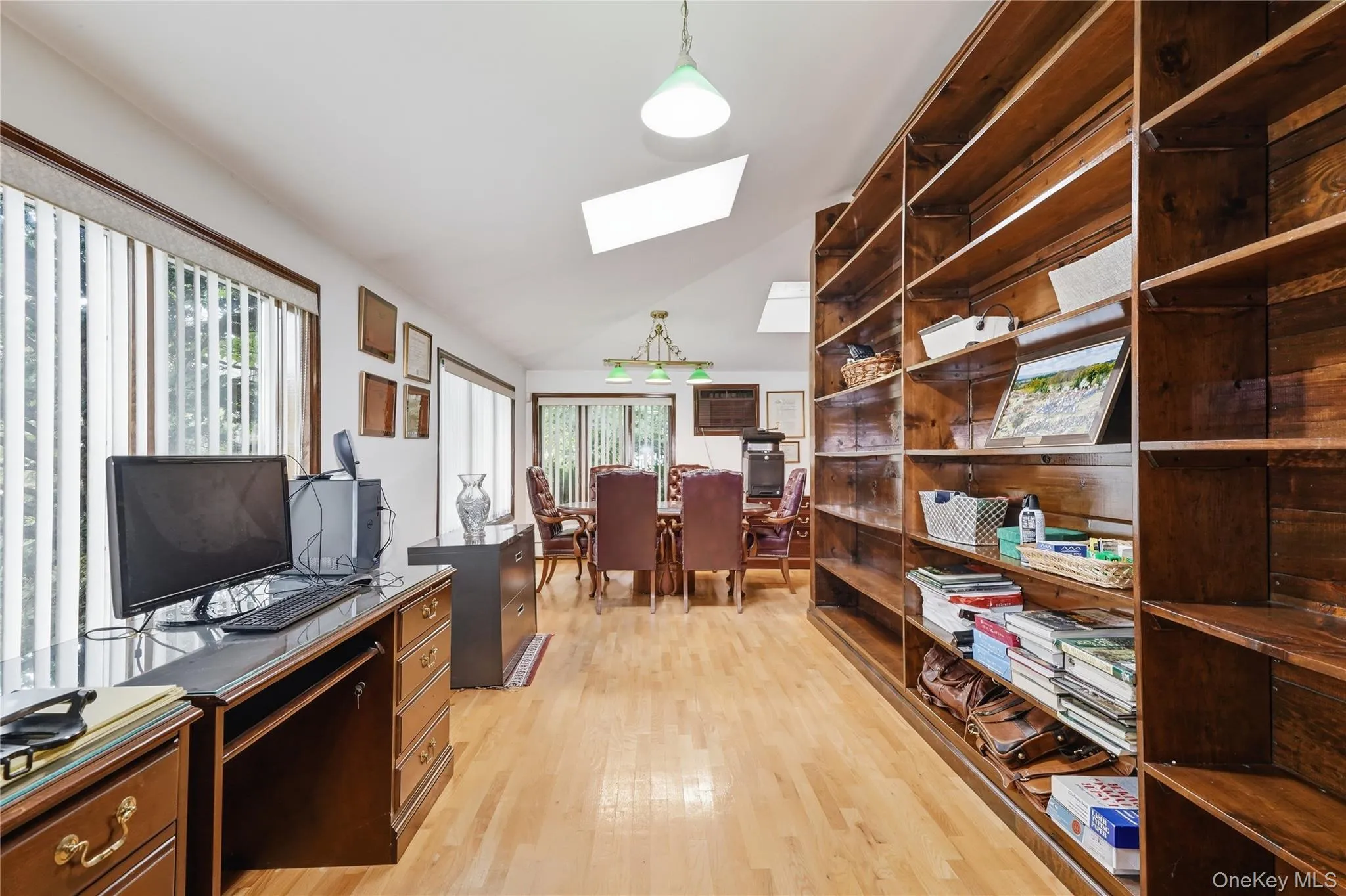 Sunlit home office features impressive floor-to-ceiling built-ins Sunlit home office features impressive floor-to-ceiling built-ins