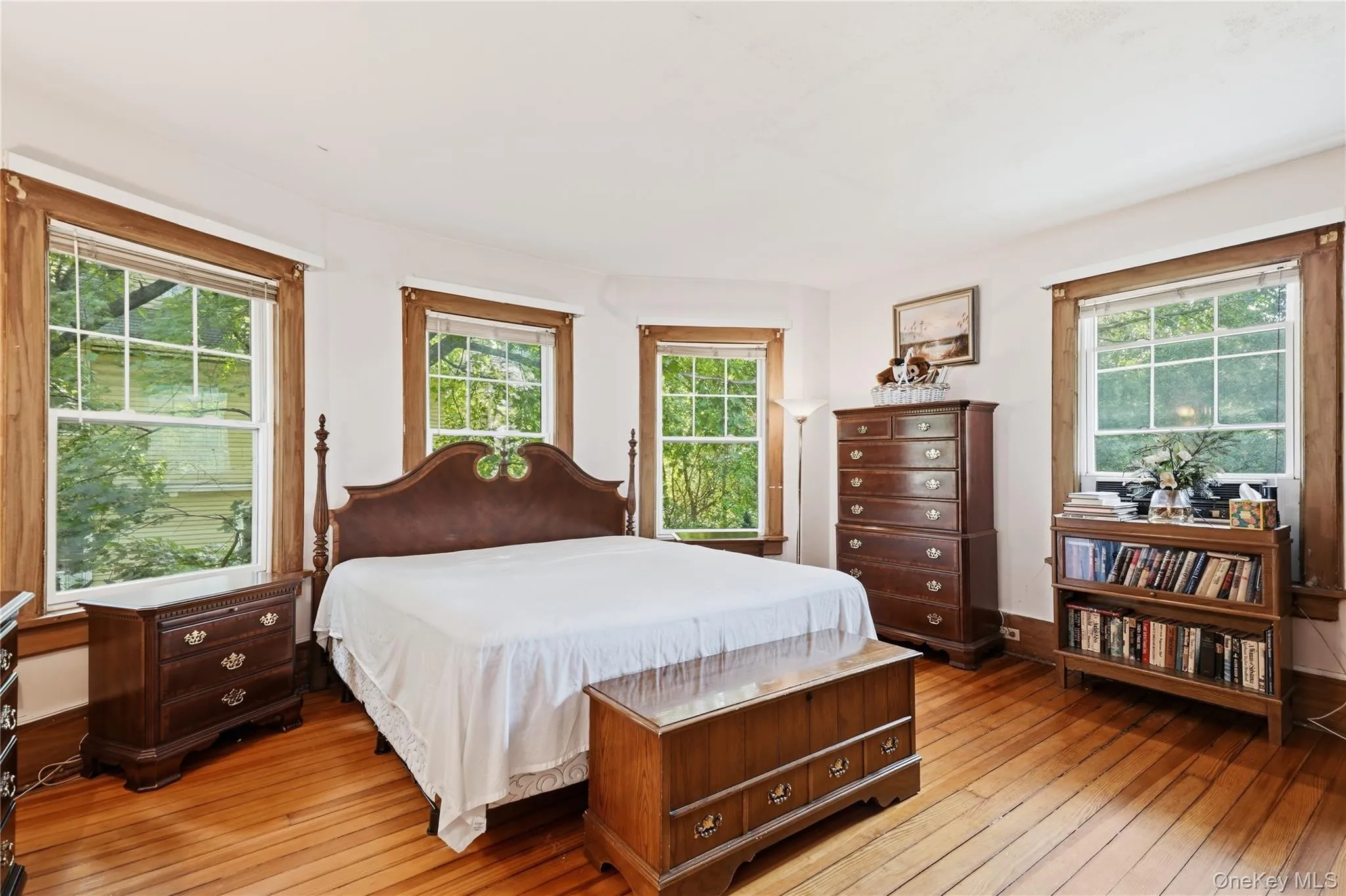Spacious primary bedroom enjoys windows on three sides Spacious primary bedroom enjoys windows on three sides